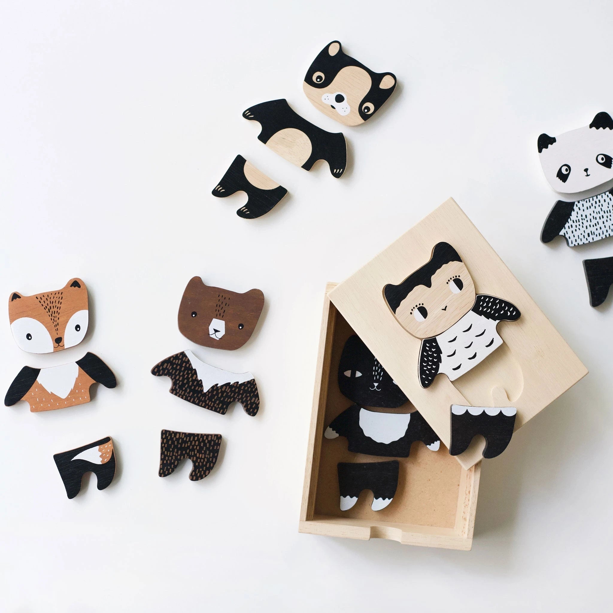Eco-friendly wooden animal toys for kids, including owl, bear, and fox, made with non-toxic materials for safe play.