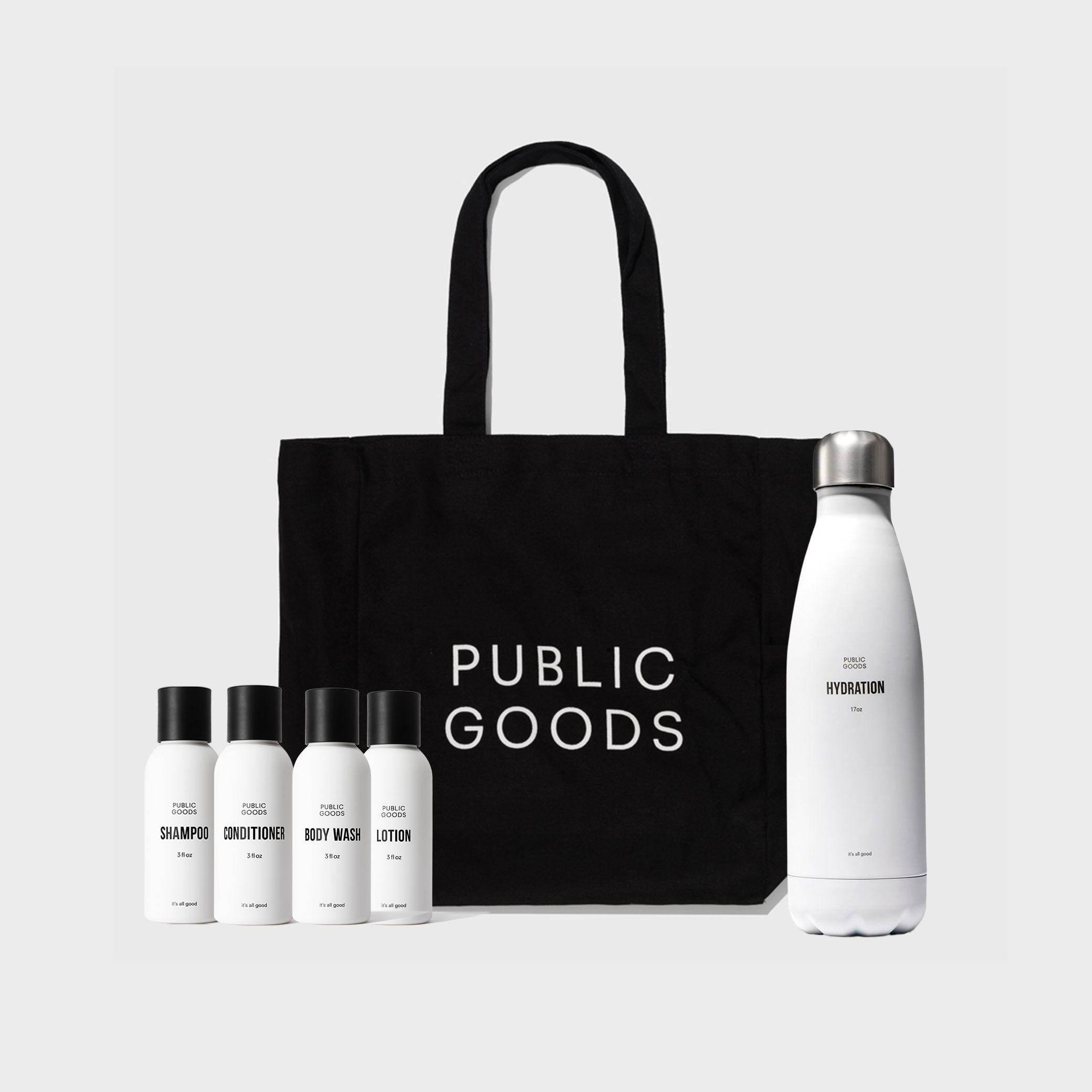 Black tote bag with 'PUBLIC GOODS' branding, accompanied by white bottles and a water bottle on a light gray background.
