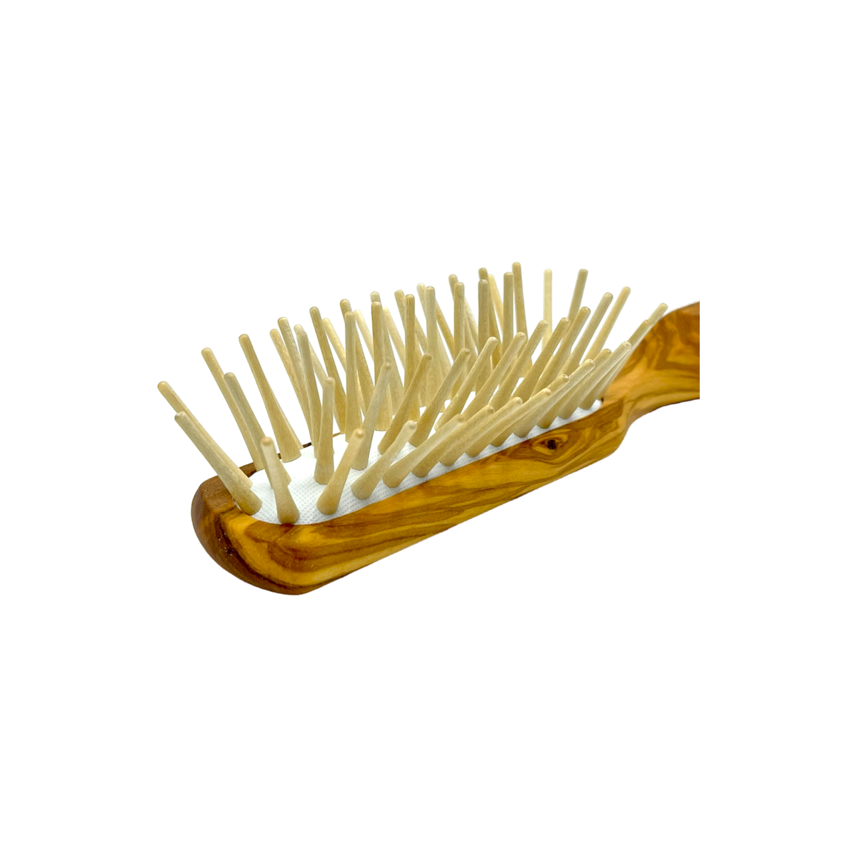 Wooden hairbrush with bristles on a white background