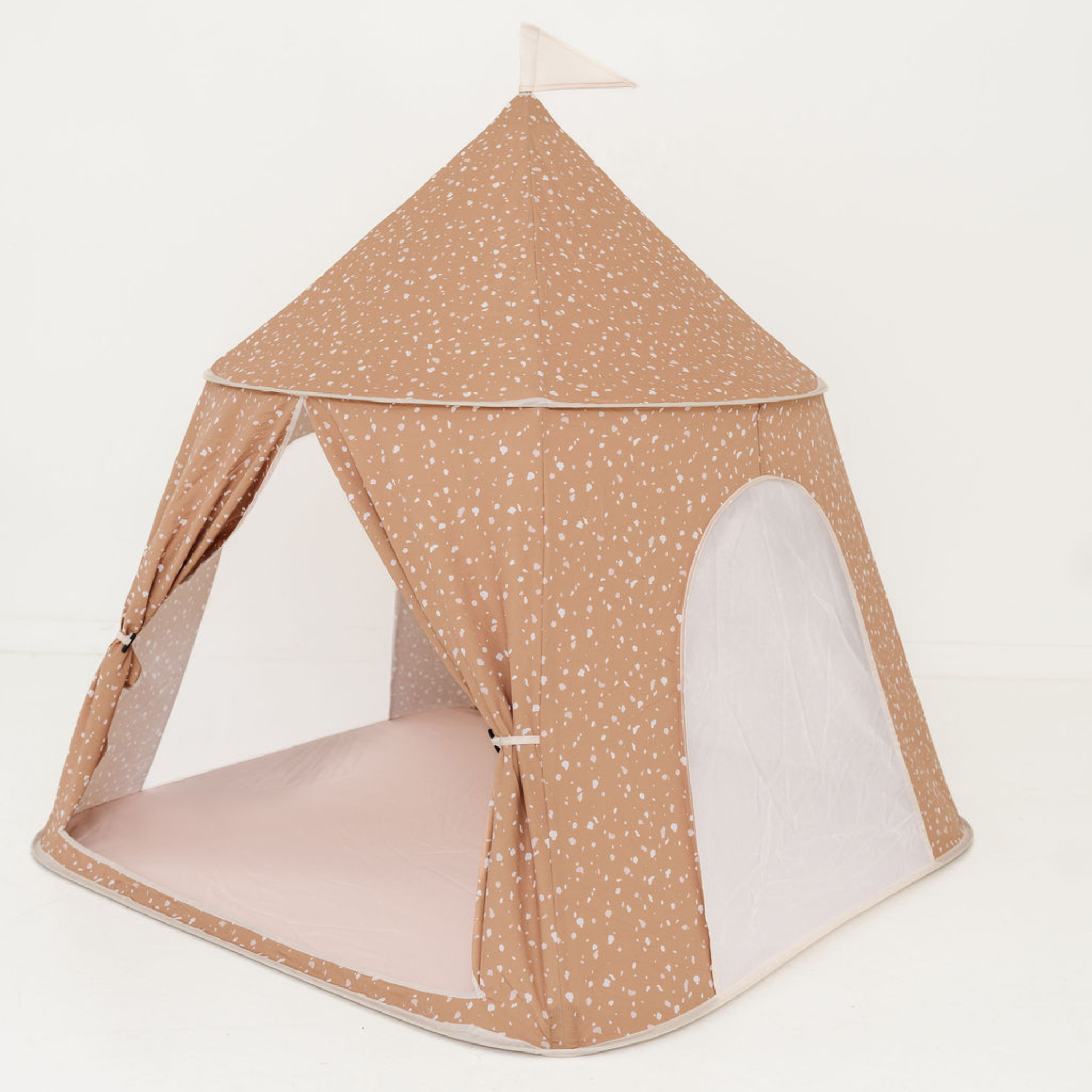Children's play tent with beige and white polka dot design on a light background