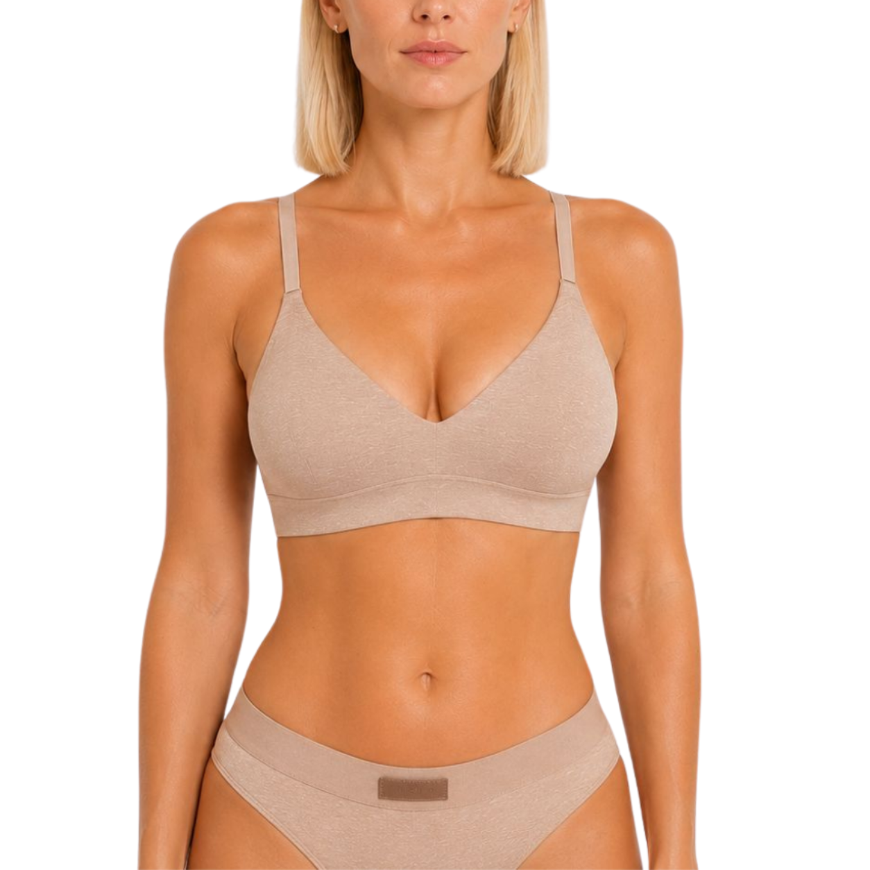 Woman wearing a beige bra and underwear set on a white background