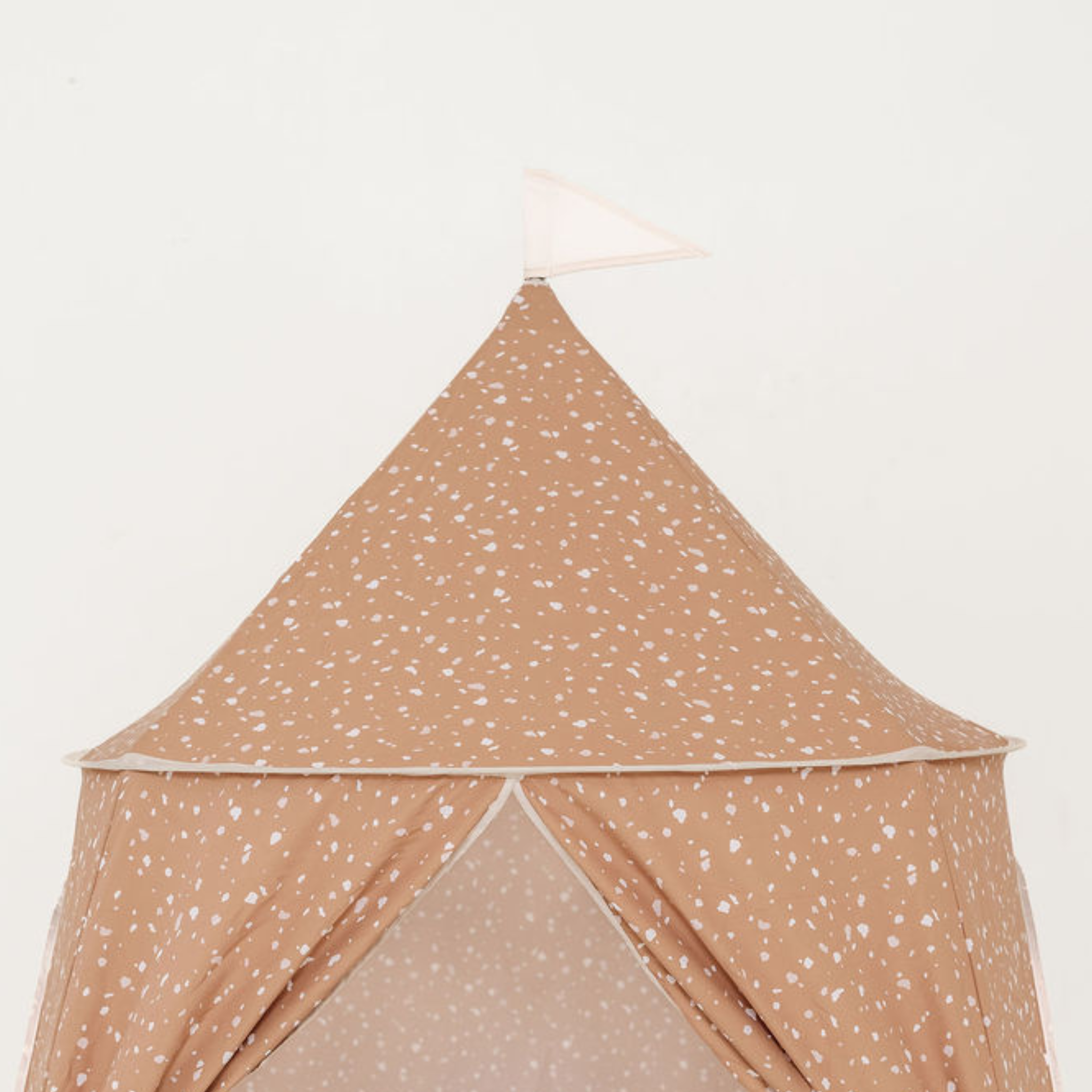 Beige children's play tent with white speckles on a light beige background