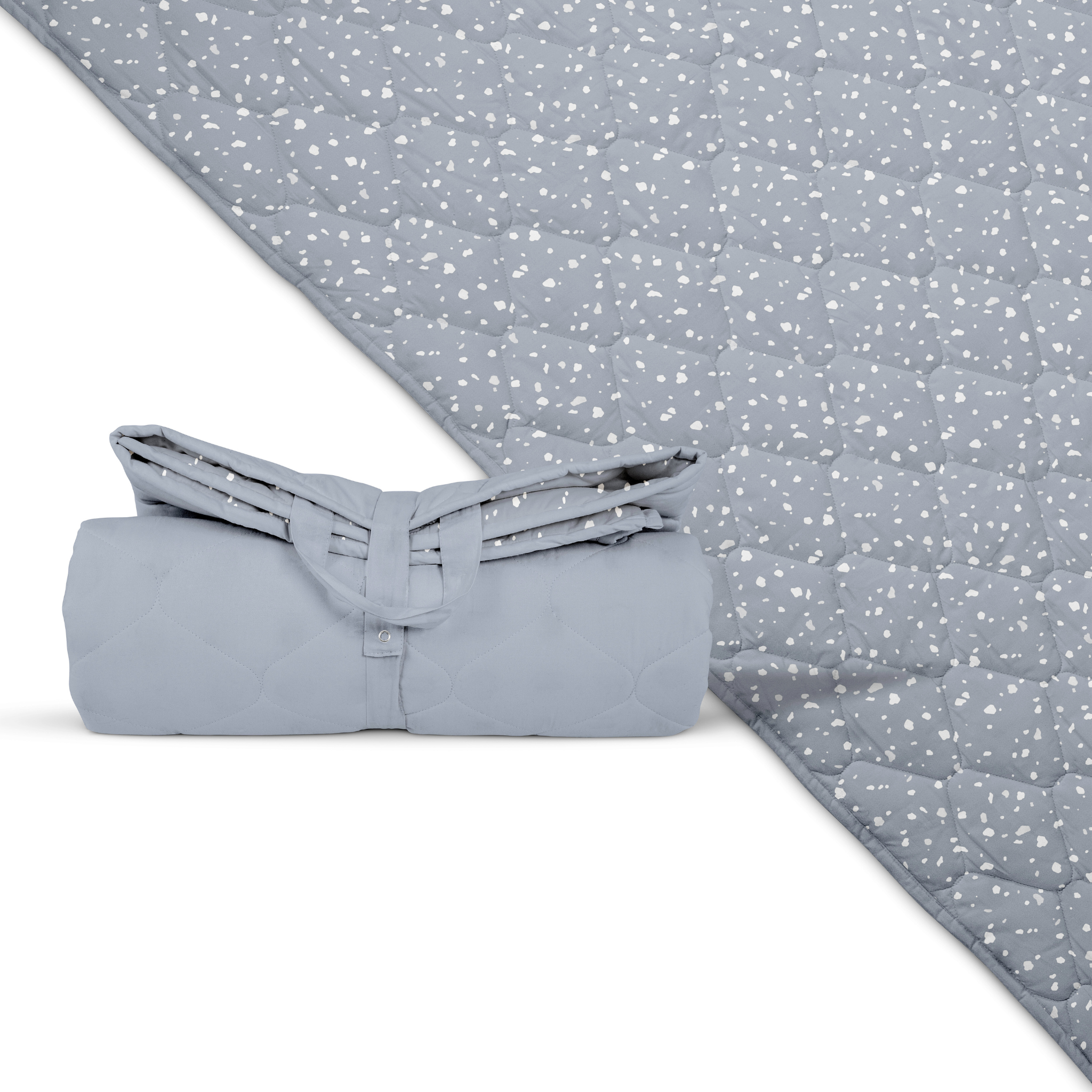 Folded light gray quilt with a subtle pattern on a matching fabric background