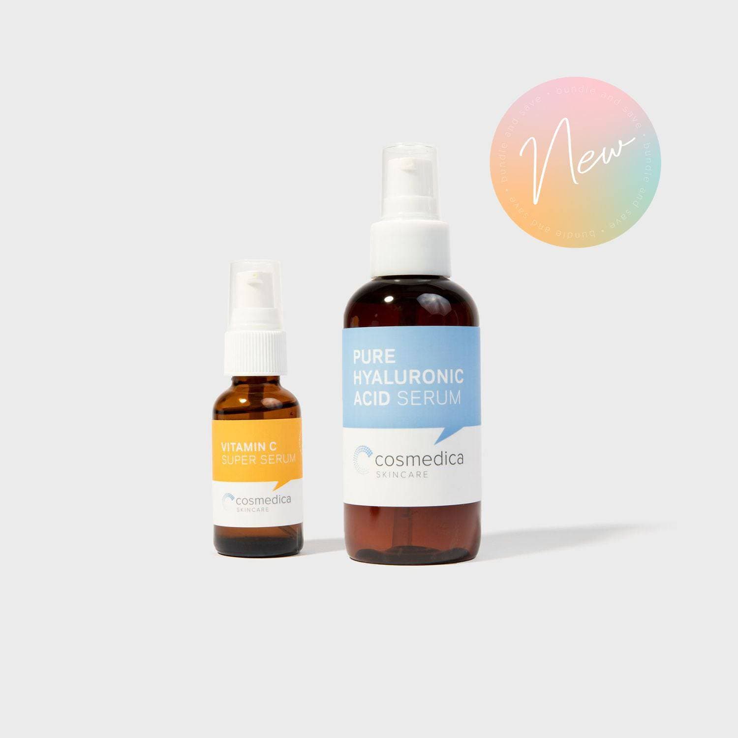 Two skincare serum bottles from cosmedica on a light gray background with 'New' label.