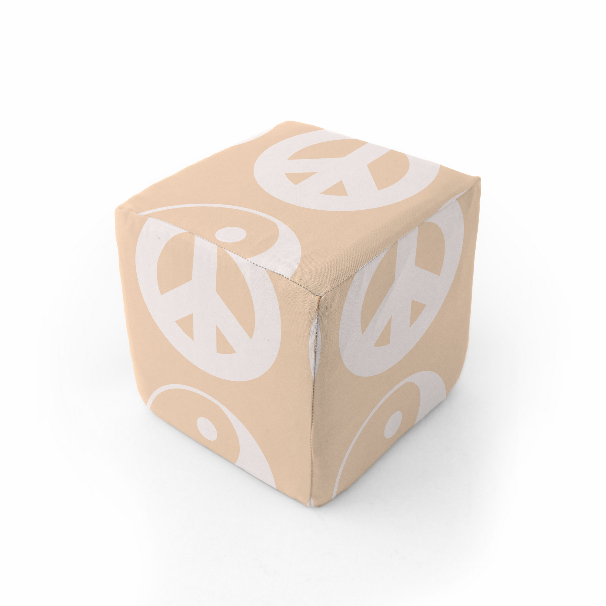Beige play cube with a yin-yang pattern, placed on a neutral mat