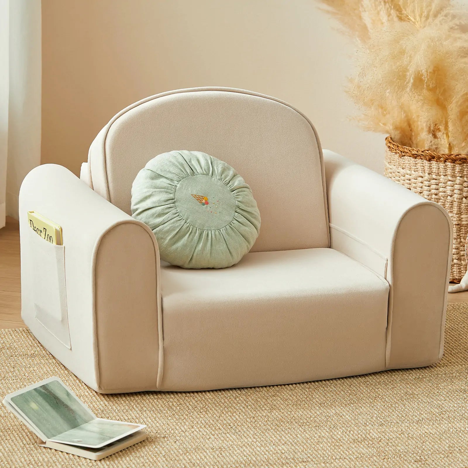 Beige children's chair with a green cushion on a beige carpet