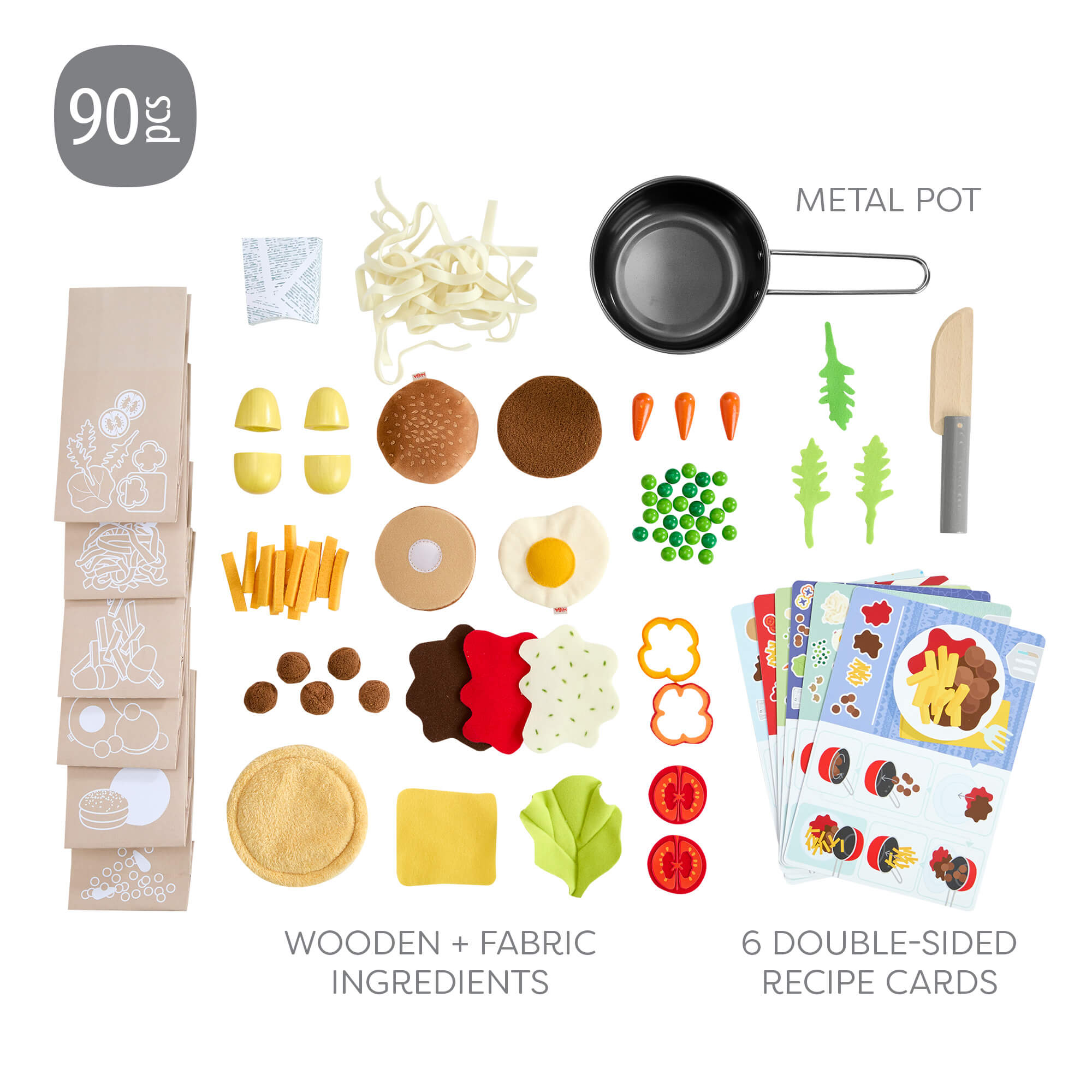 Toy food set with wooden and fabric ingredients, metal pot, and recipe cards on a white background.