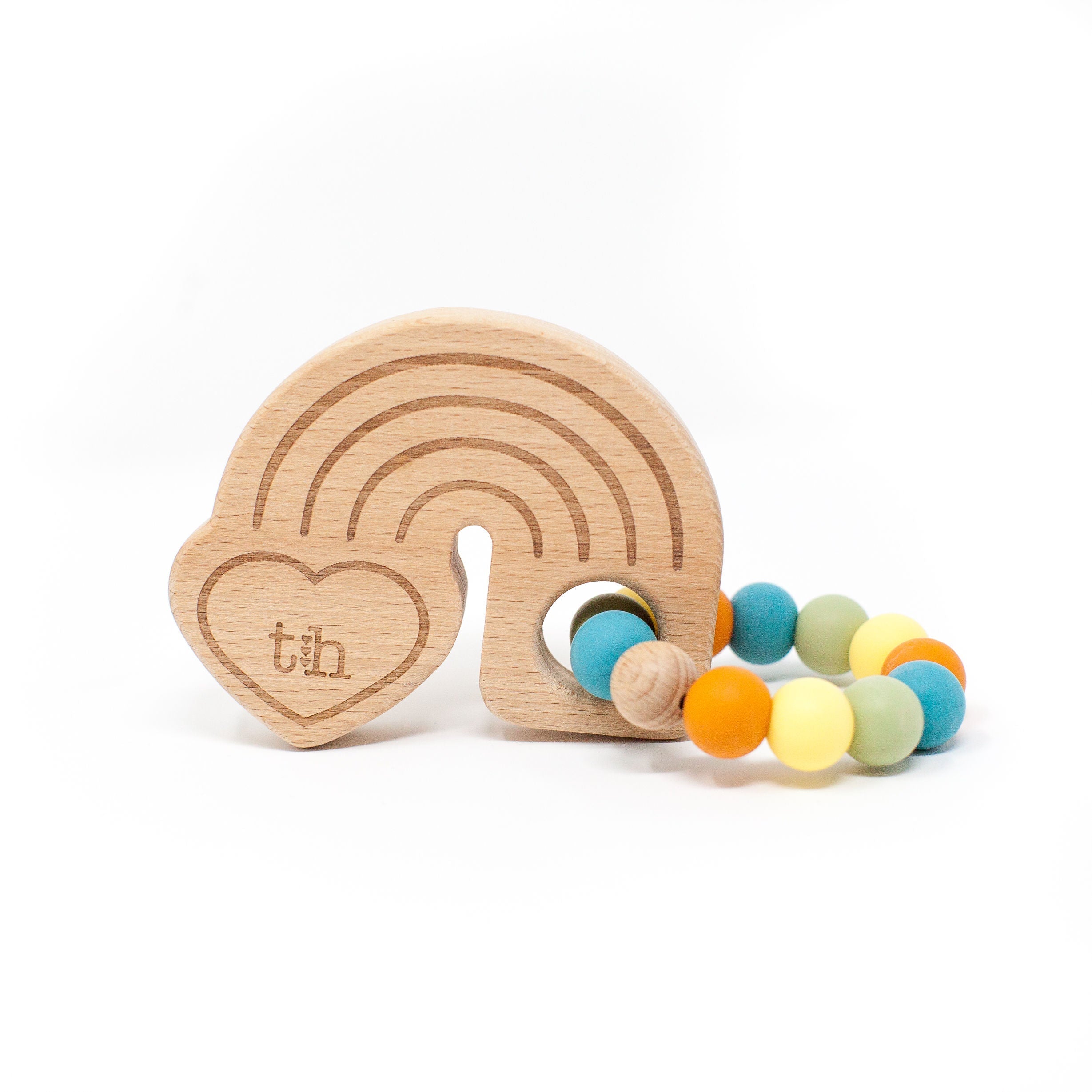 Wooden teething ring with colorful beads on a white background