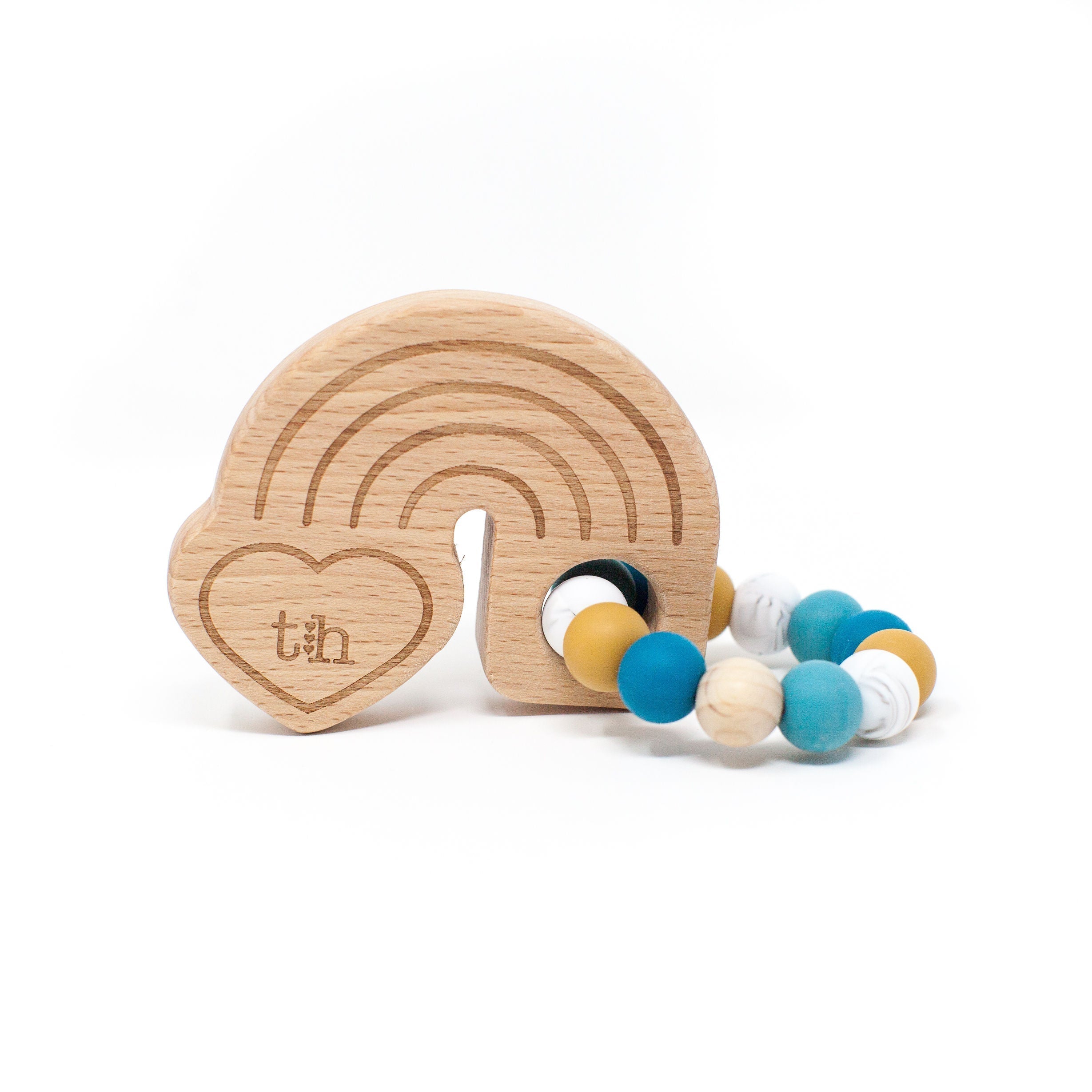 Wooden teething ring with colorful beads on a white background