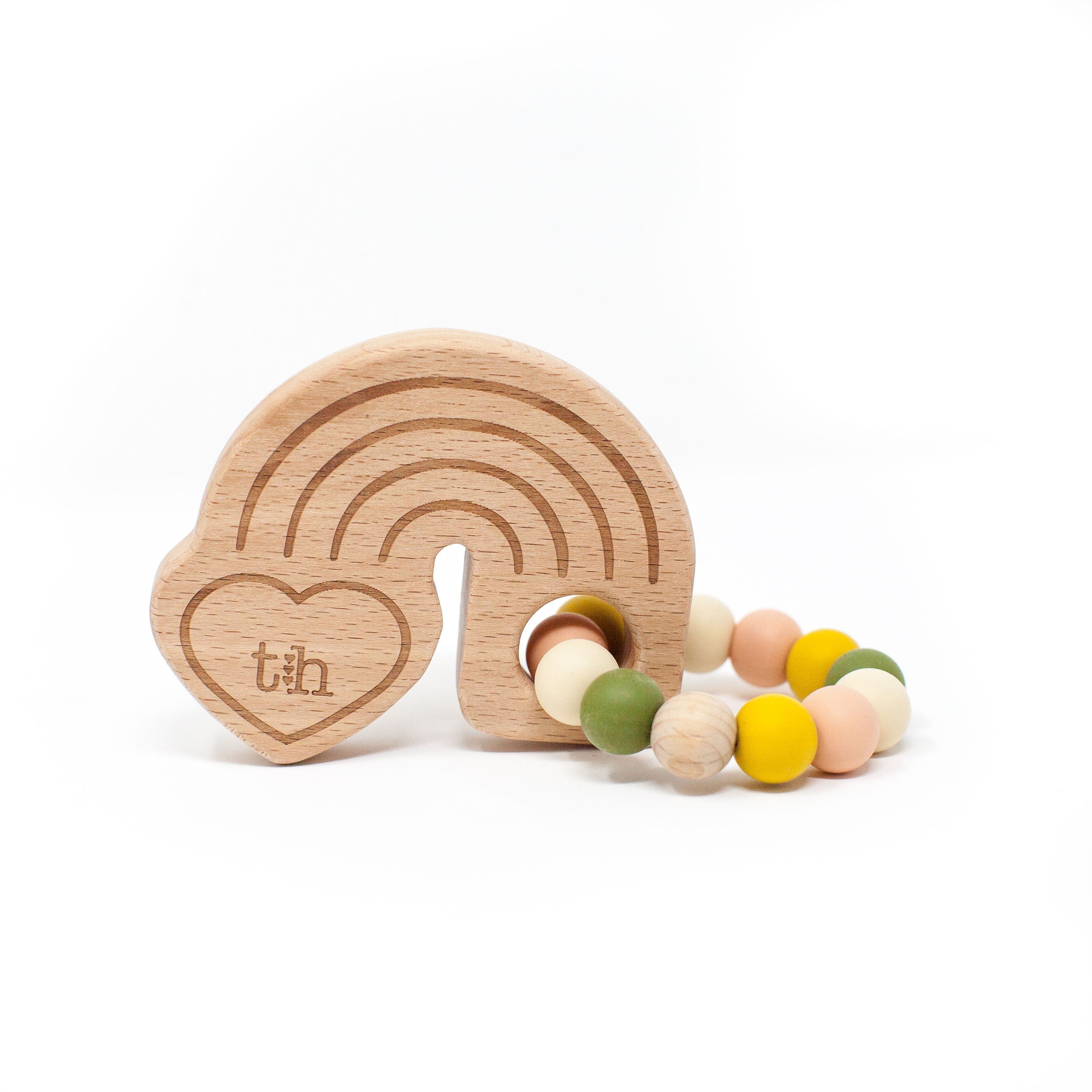 Wooden teething ring with colorful beads on a white background