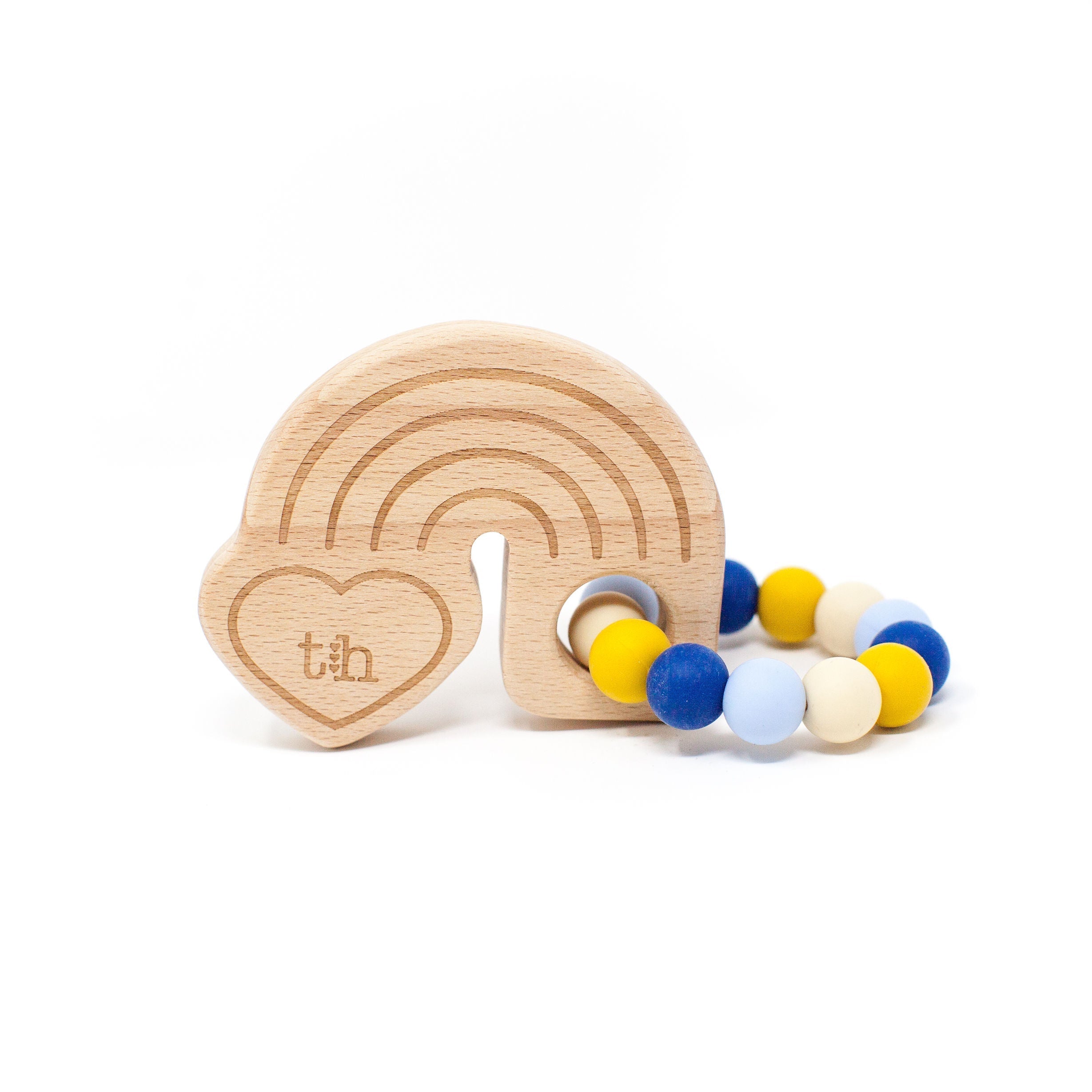 Wooden rainbow-shaped teether with colorful beads on a white background
