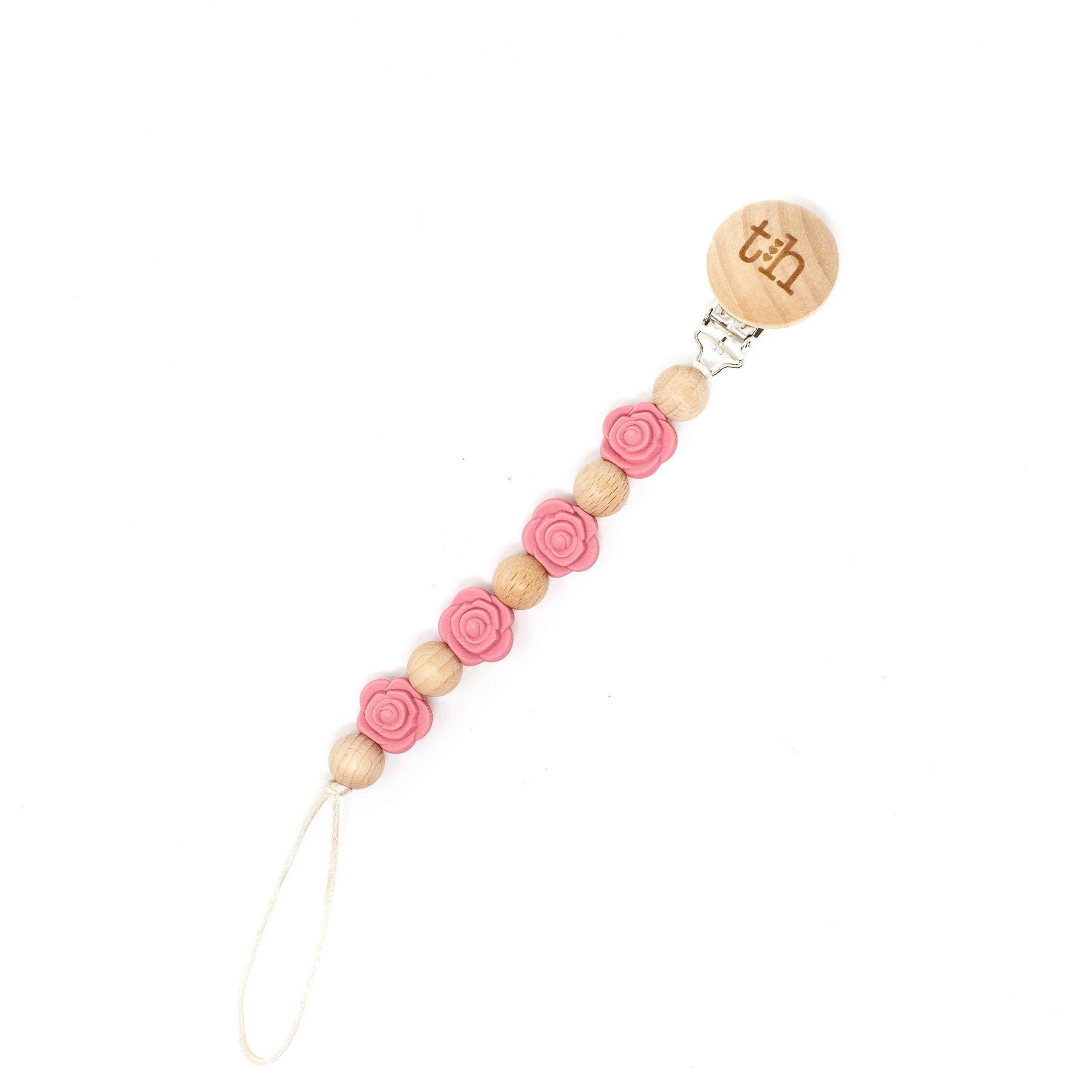 Wooden pacifier clip with pink floral beads on a white background