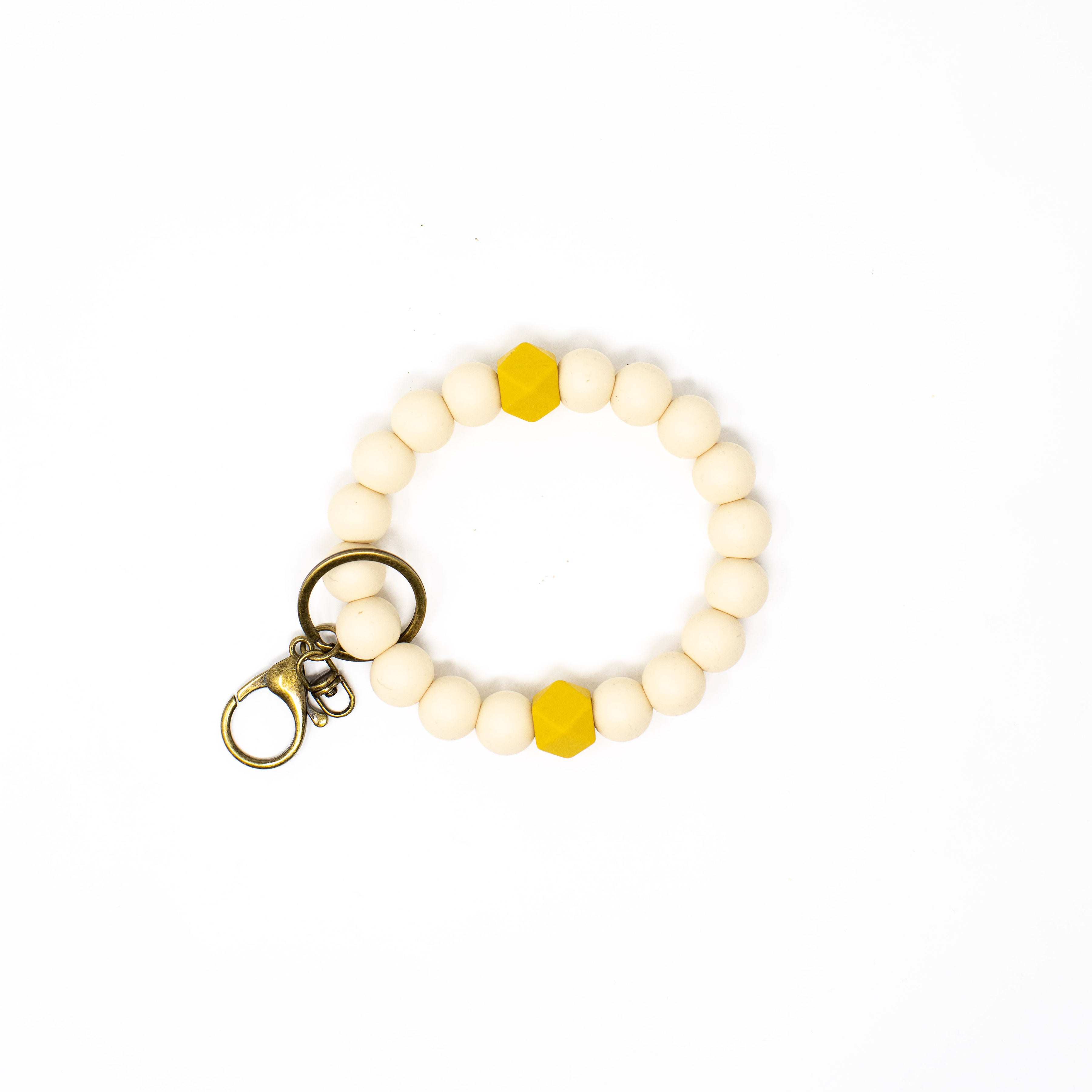Beaded keychain with yellow accents on a white background