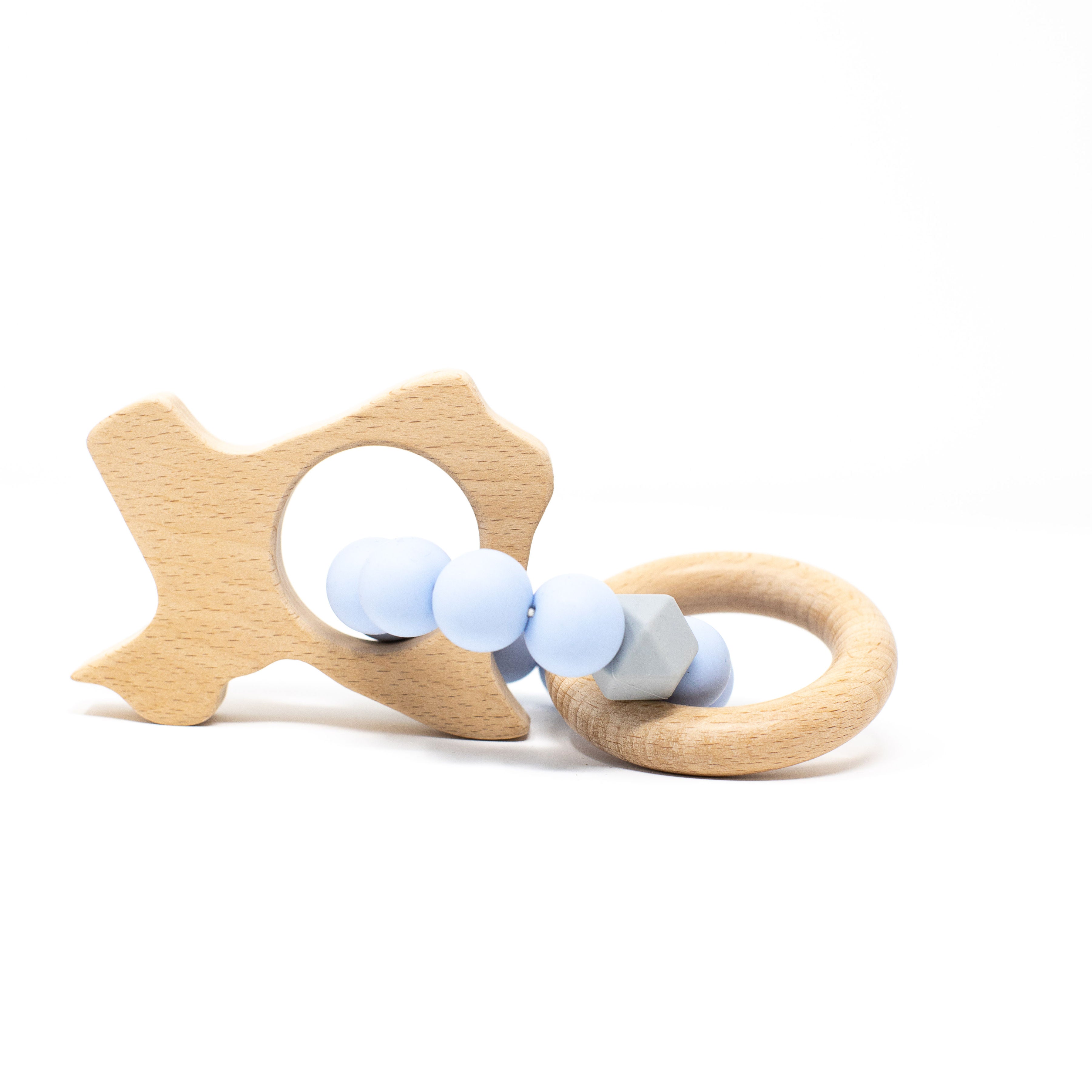 Wooden fish-shaped teether with blue beads on a white background