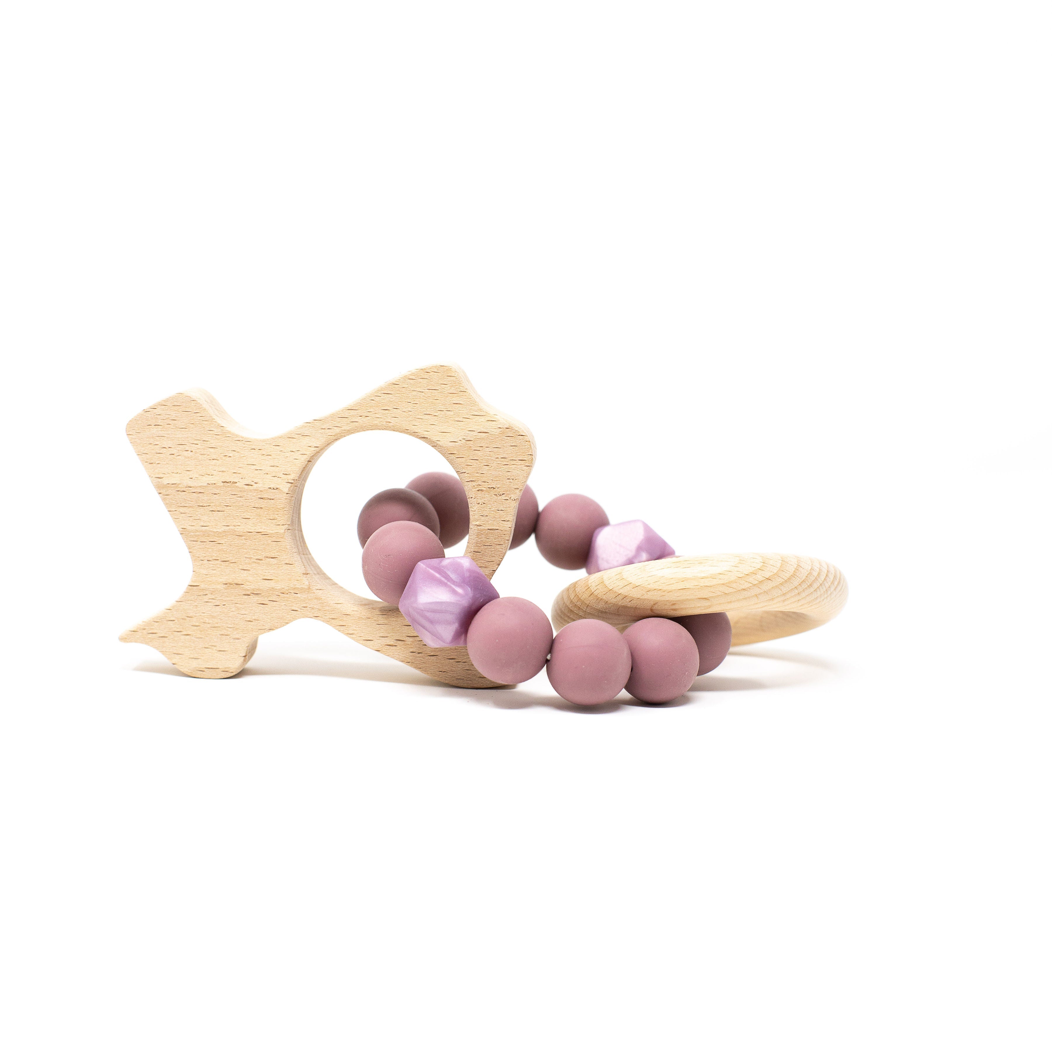 Wooden fish-shaped teether with pink silicone beads on a white background