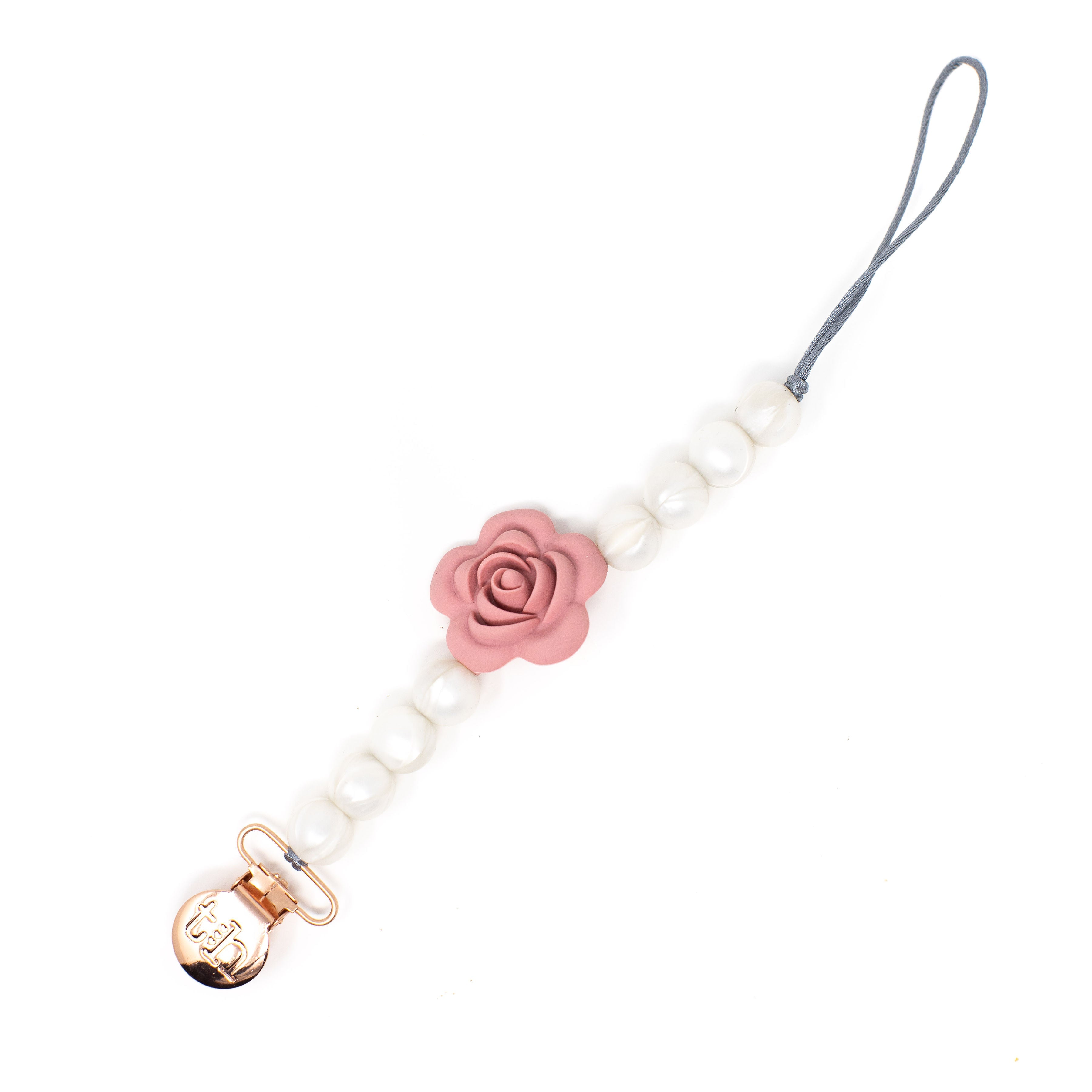 Baby pacifier clip with pink rose design and gold clasp on a white background