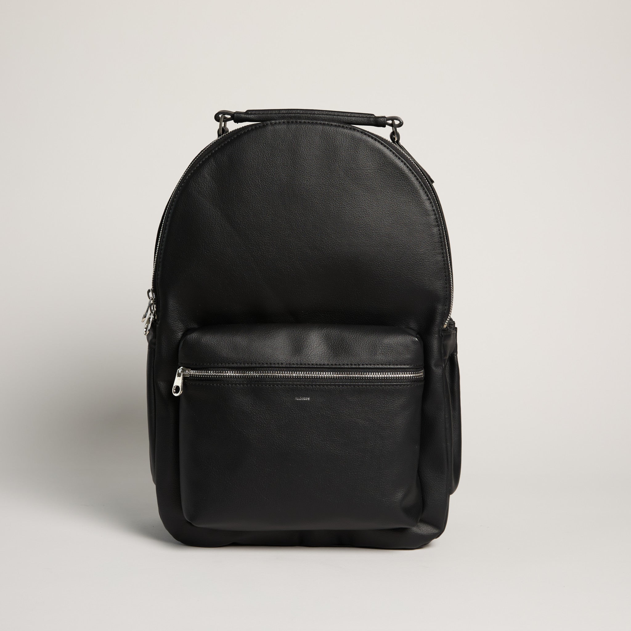 Black backpack on a light gray background
