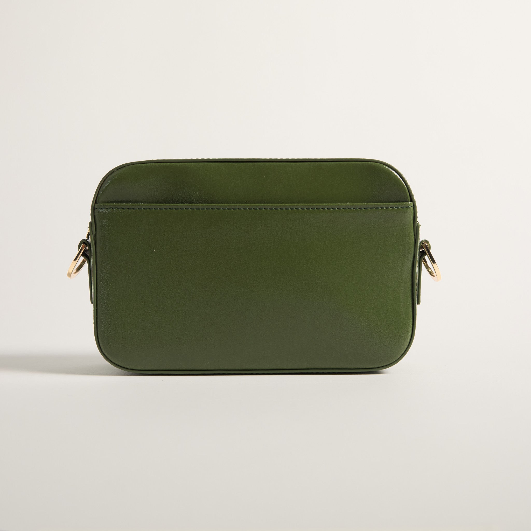 Green leather bag on a light gray background