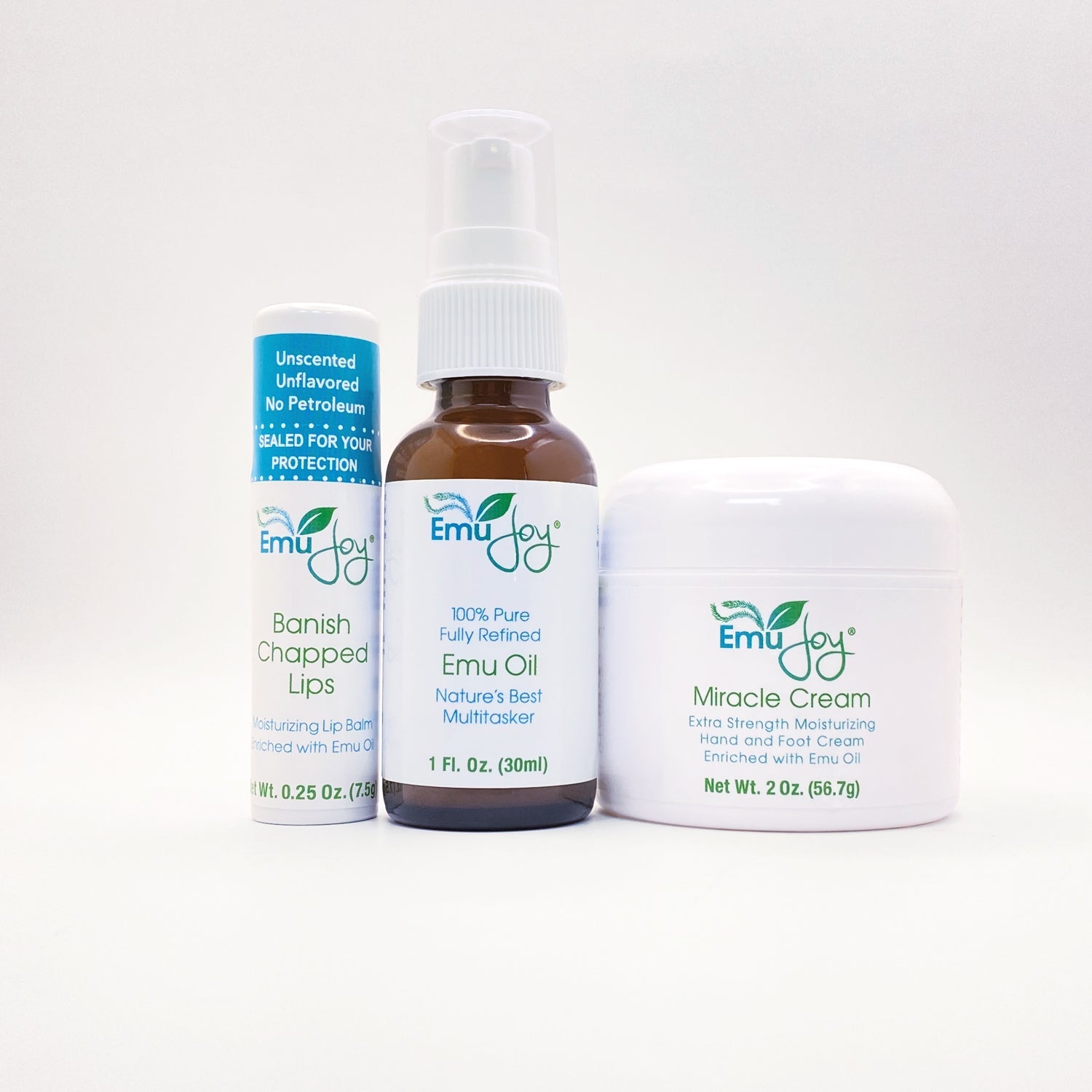 Three Emu Joy products including a spray bottle, oil, and cream on a white background