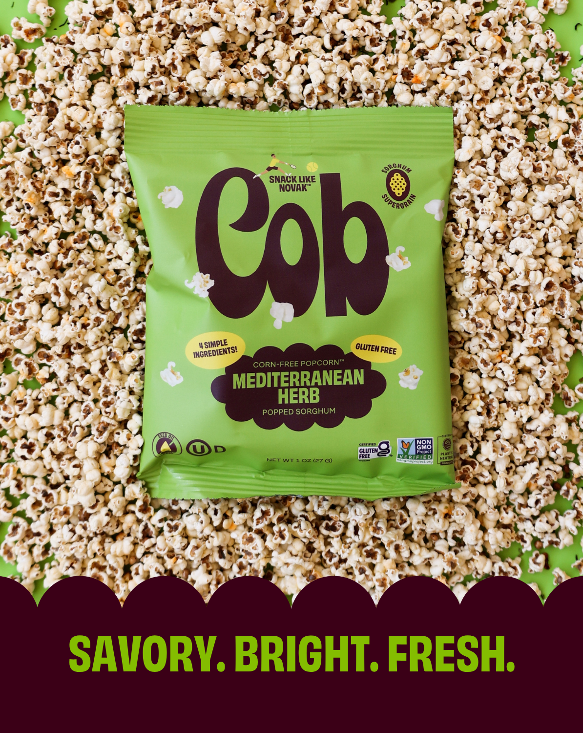 Green 'Cob' popcorn bag on a bed of popcorn with 'Savory. Bright. Fresh.' text.