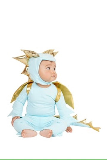 A baby wearing a light blue dragon costume with gold wings and gold spikes on the hood, sitting against a plain white background.