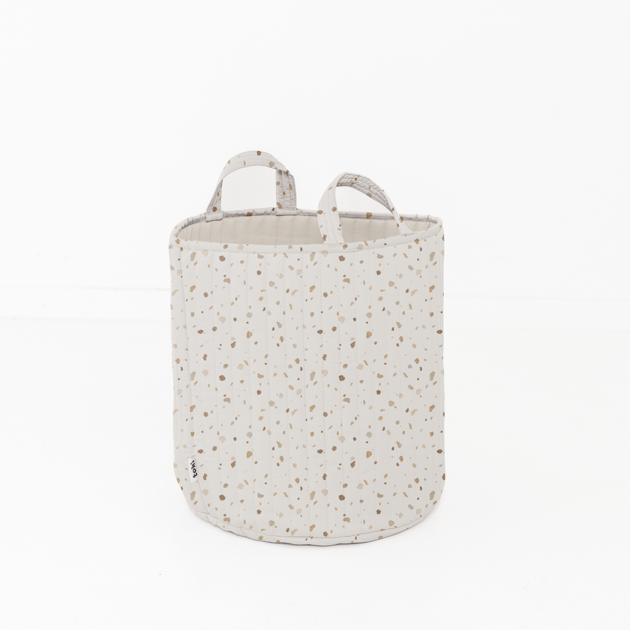 Speckled patterned storage basket on a white background