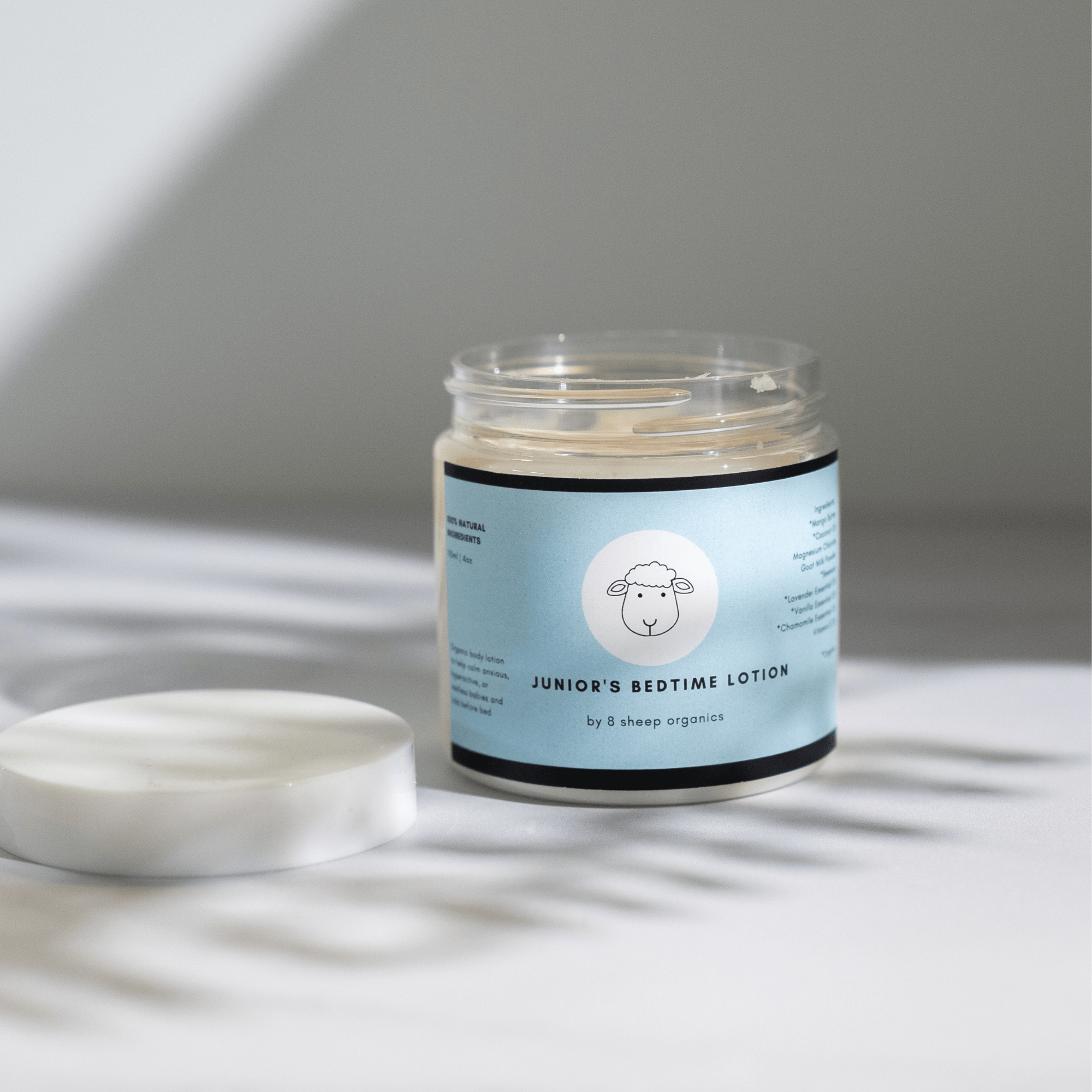 Jar of 'Junior's Bedtime Lotion' with a label on a light background