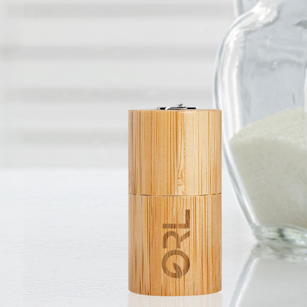 Bamboo grinder with 'ORL' branding on a light background