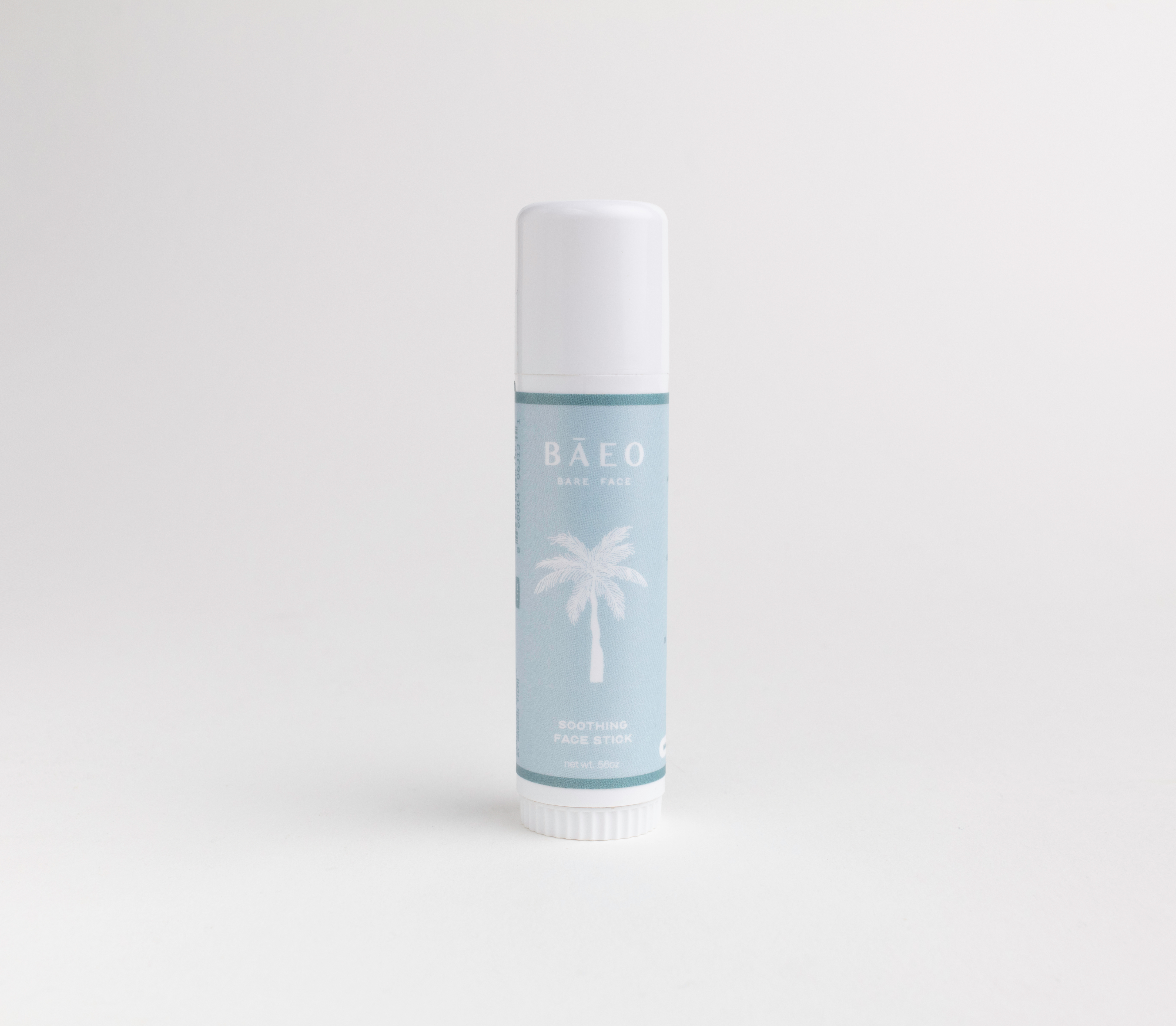 Deodorant stick with palm tree design on a light gray background
