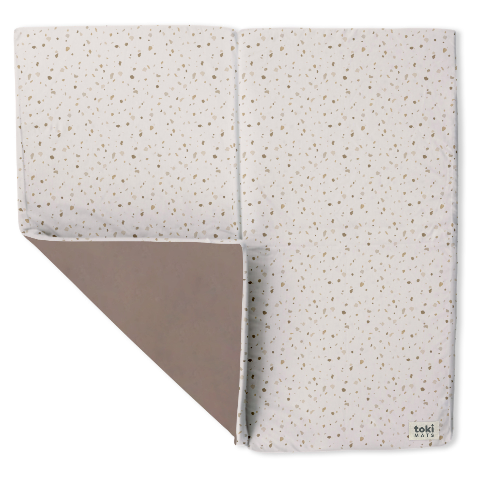 Folded blanket with a speckled pattern on a white background