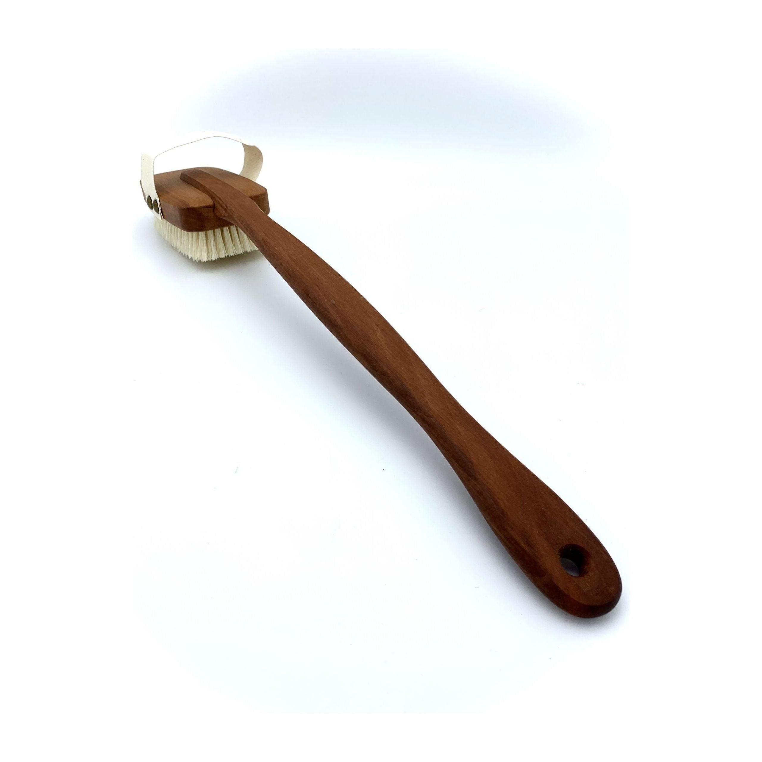 Cleaning brush with wooden handle on a white background