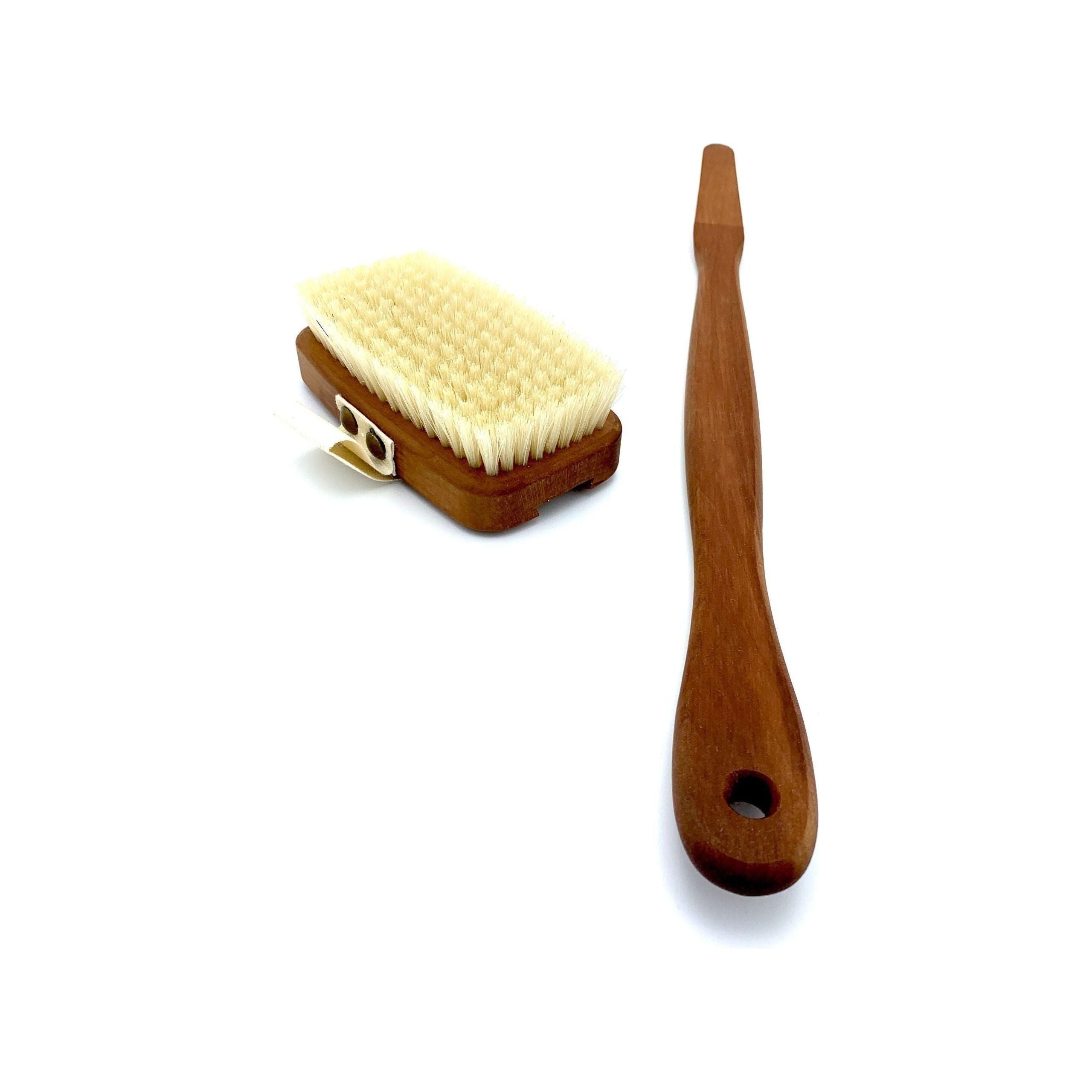 Two wooden brushes on a white background