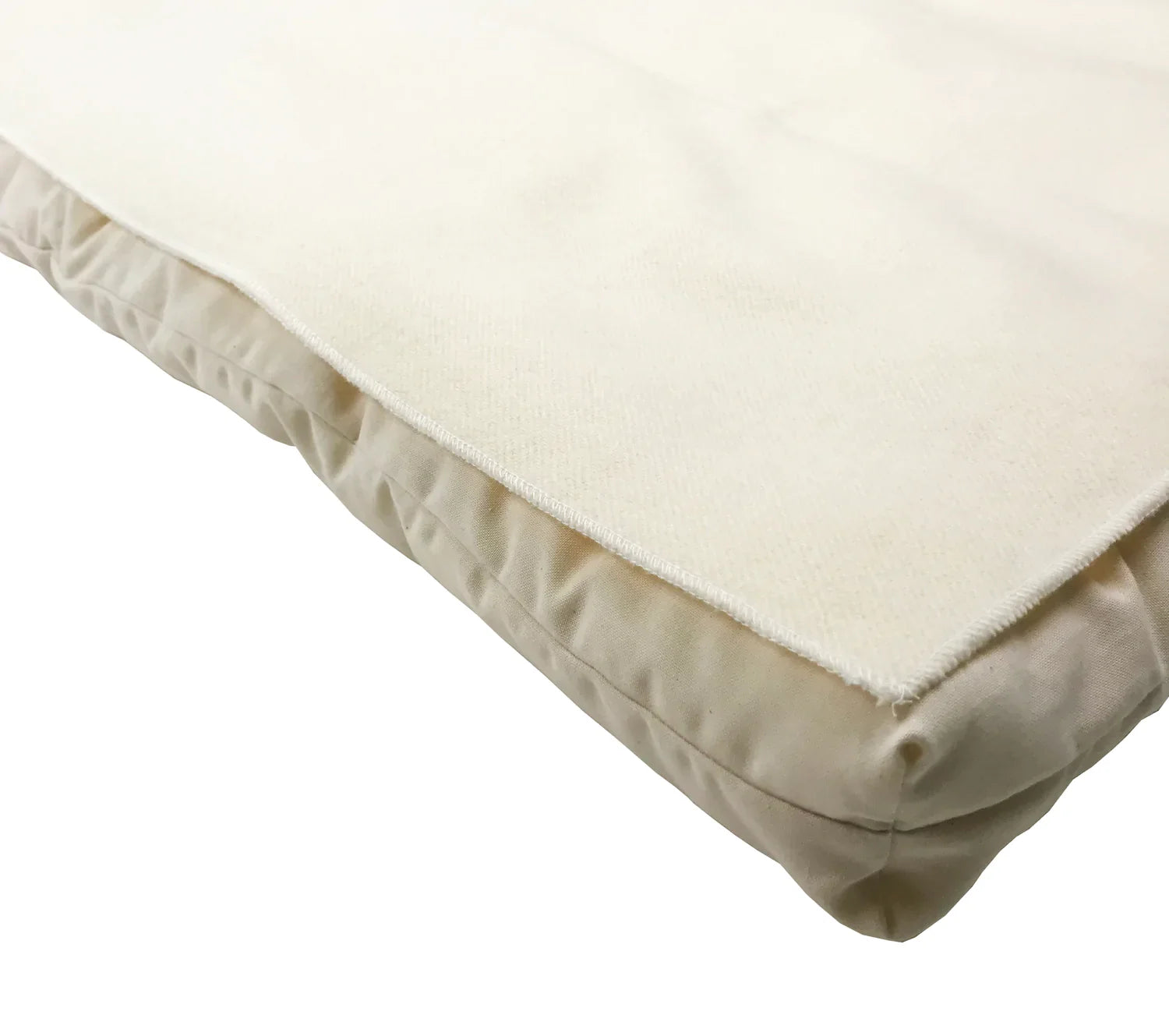 Close-up of a beige mattress topper on a white background