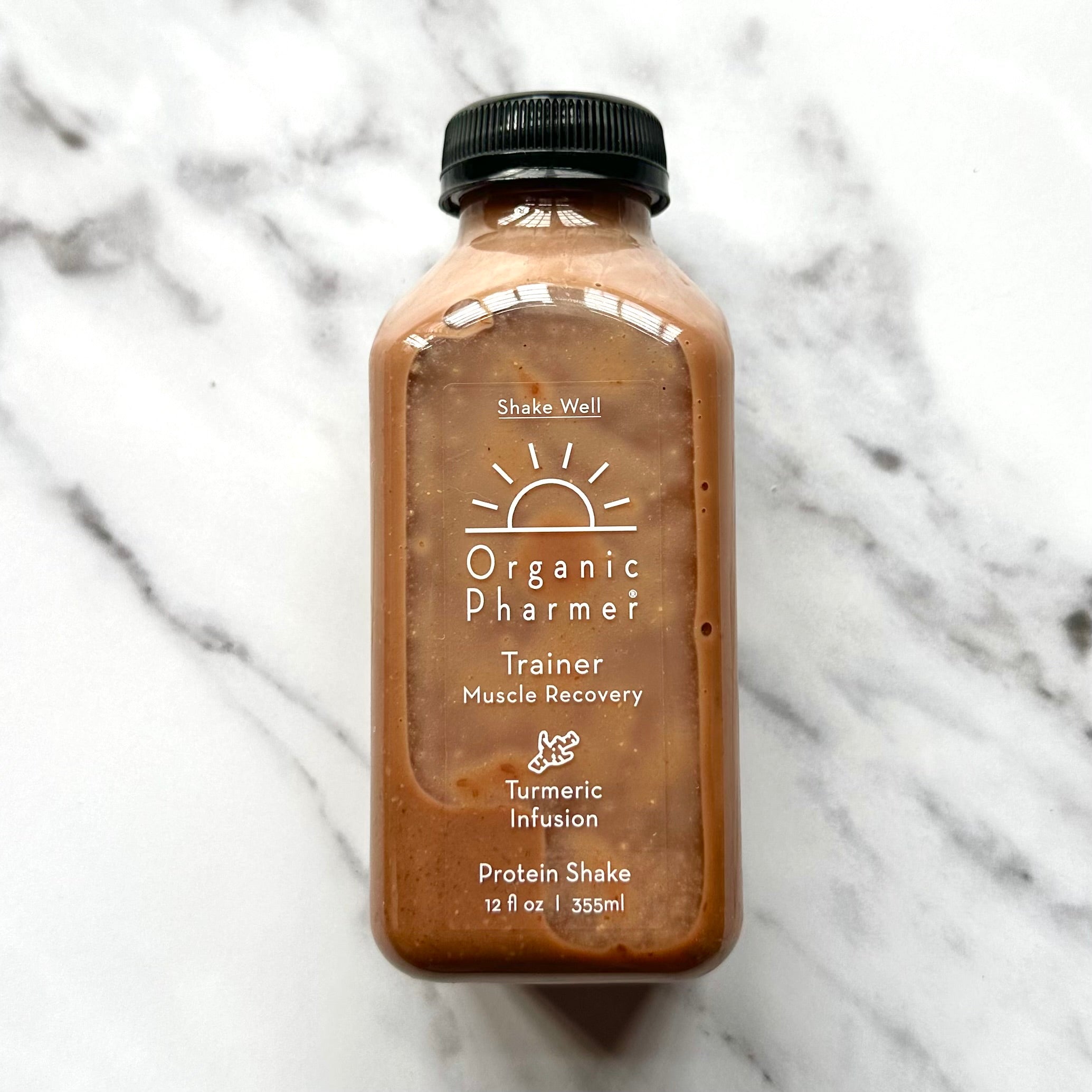 Bottle of Organic Pharmer Protein Shake on a marble surface