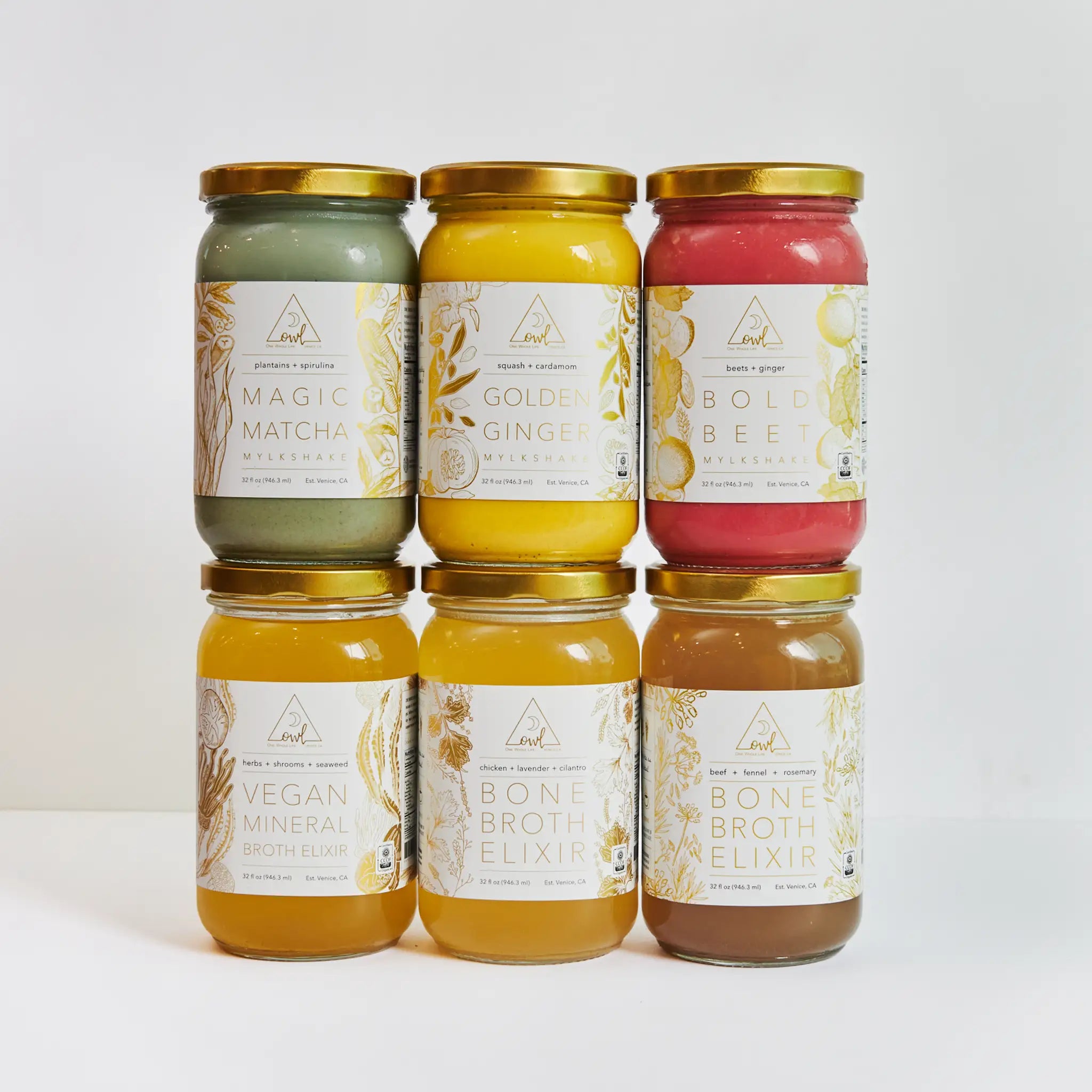 Six jars of different types of bone broth on a white background