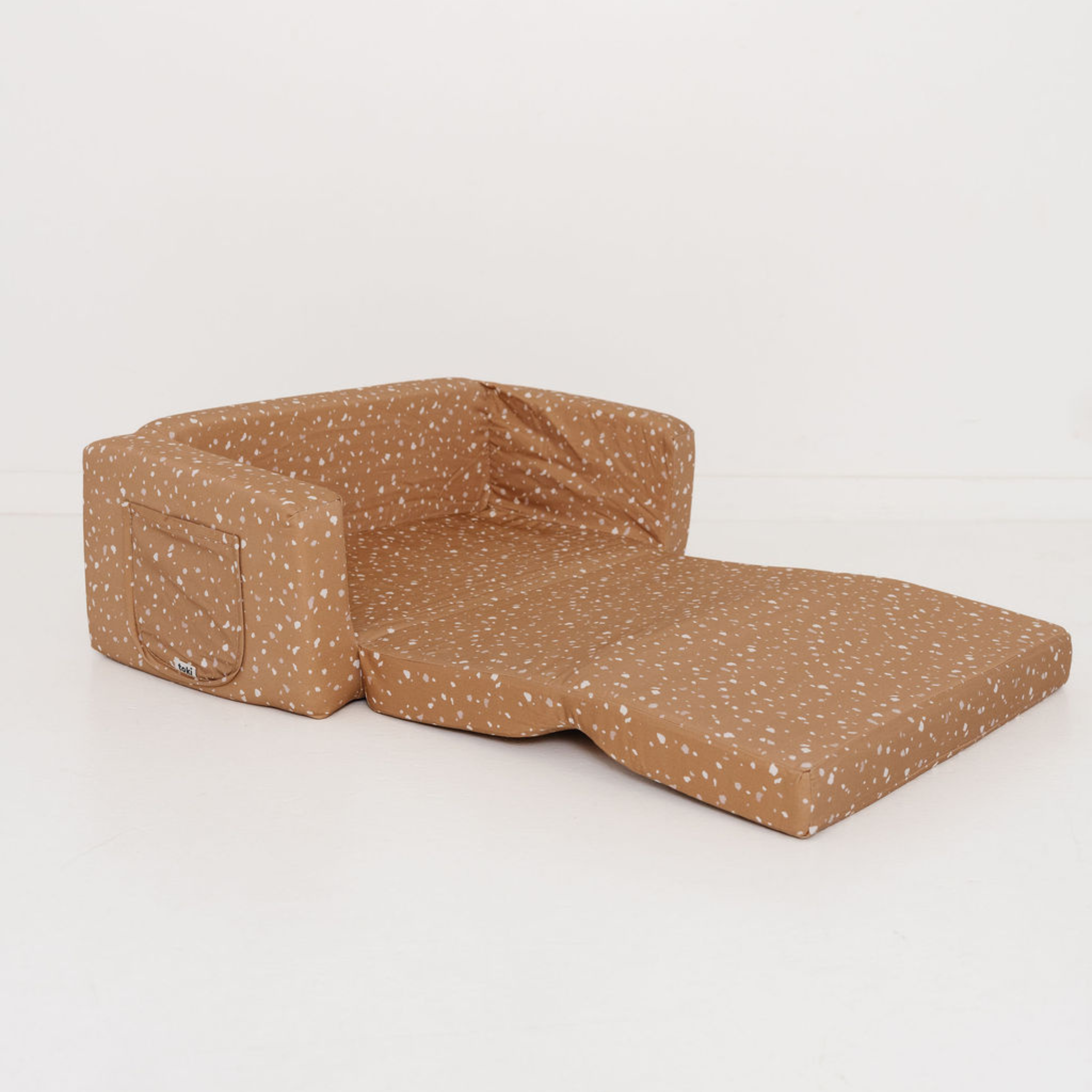 Brown speckled pet bed on a white background