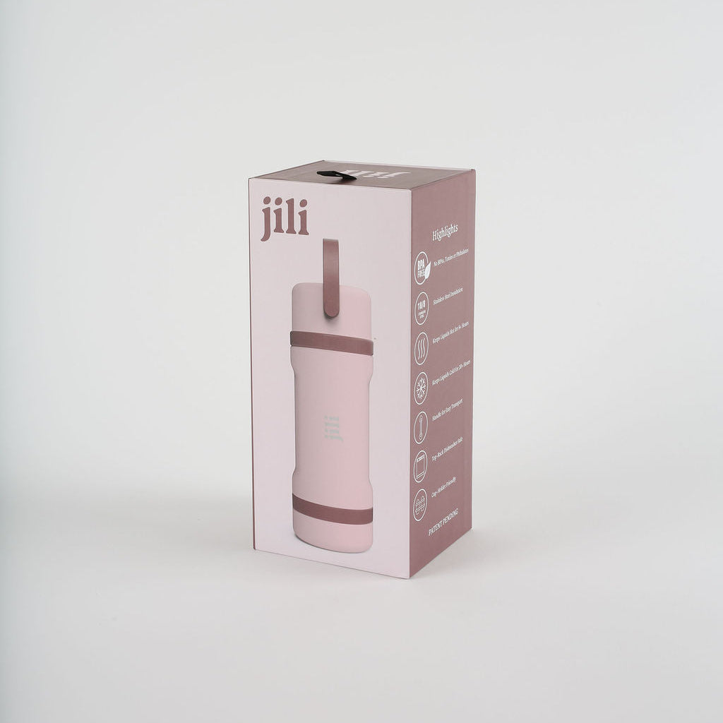 Pink water bottle in a 'jili' branded box on a white background
