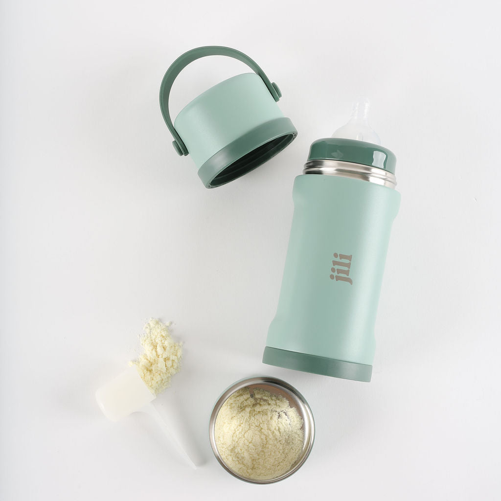 Mint green thermos with a handle on a white background
