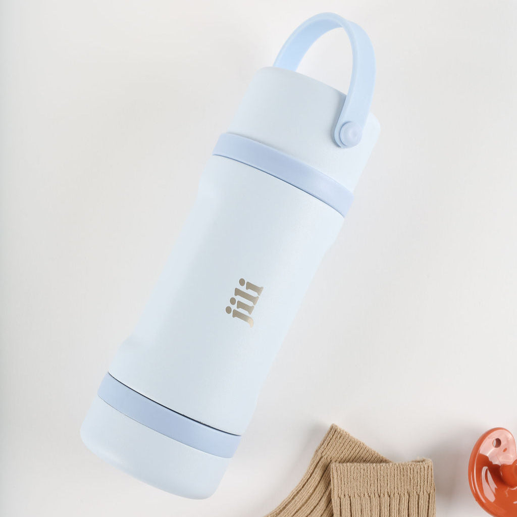 Light blue insulated bottle with a handle on a white background
