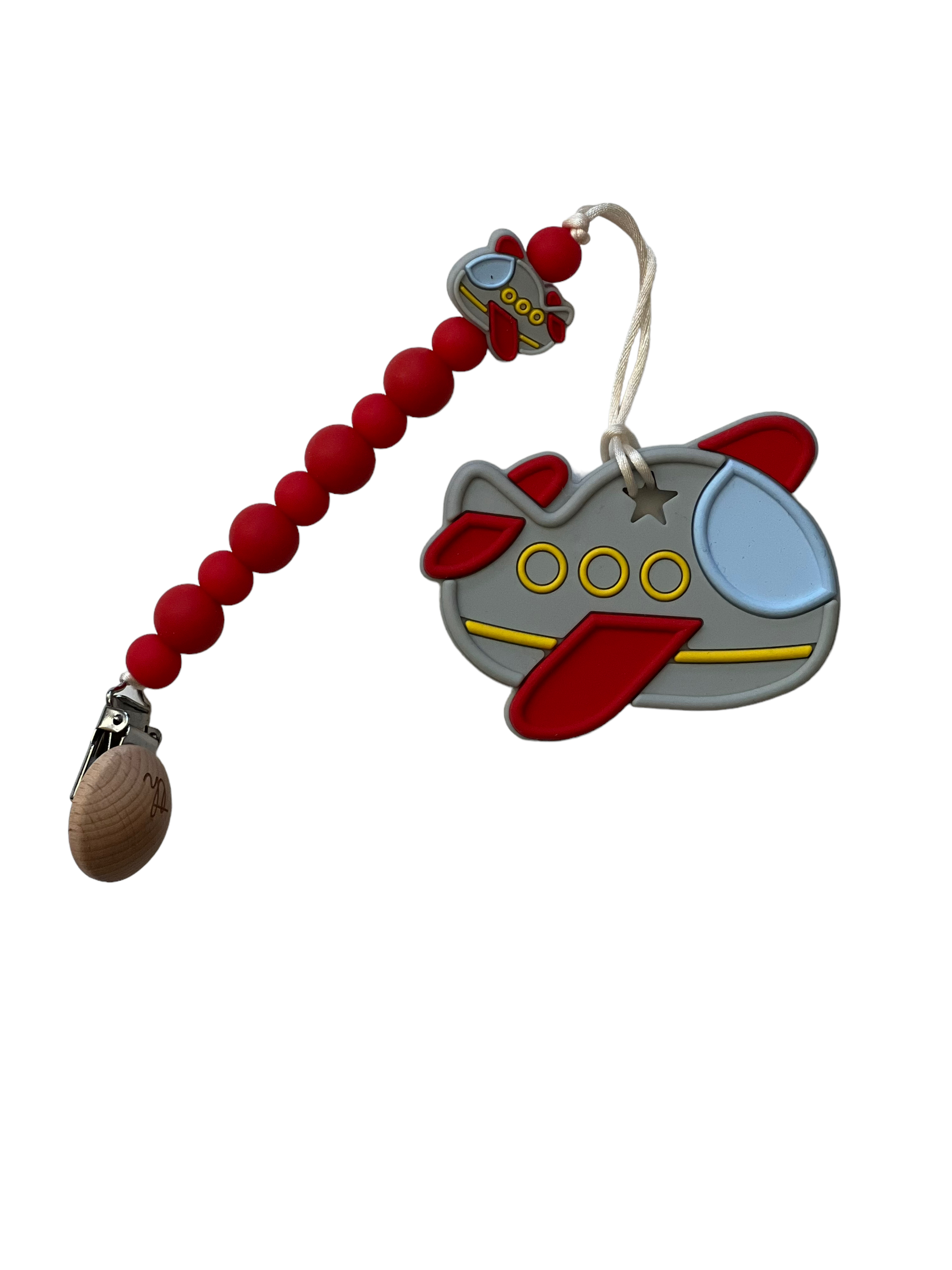 Toy spaceship with red beaded chain on a white background