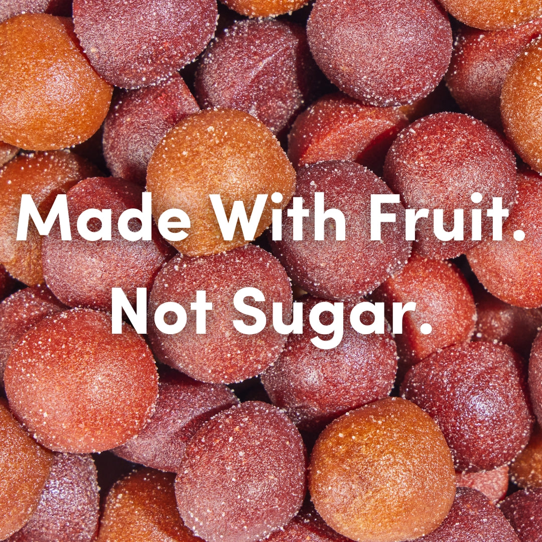 Frosted fruit balls with text 'Made With Fruit. Not Sugar.'
