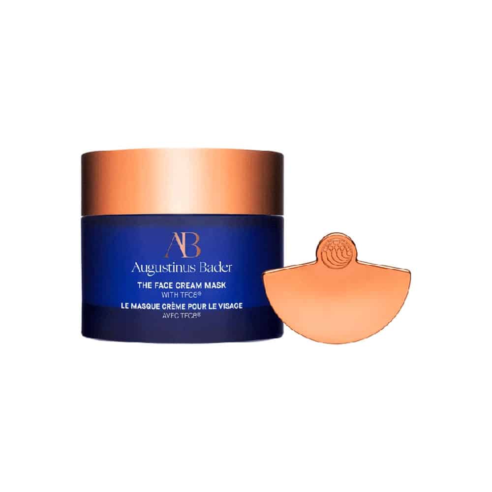 Augustinus Bader face cream mask with a blue container and bronze lid on a white background