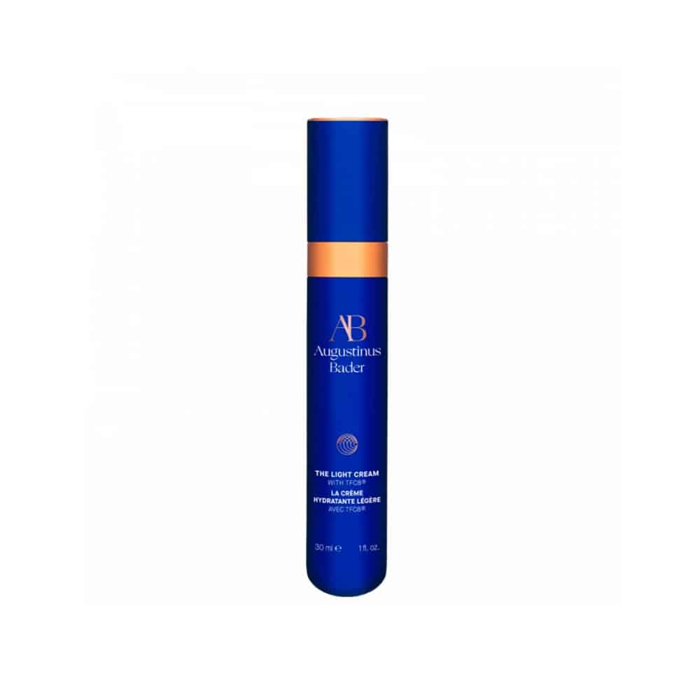 Blue skincare bottle with gold accents on a white background