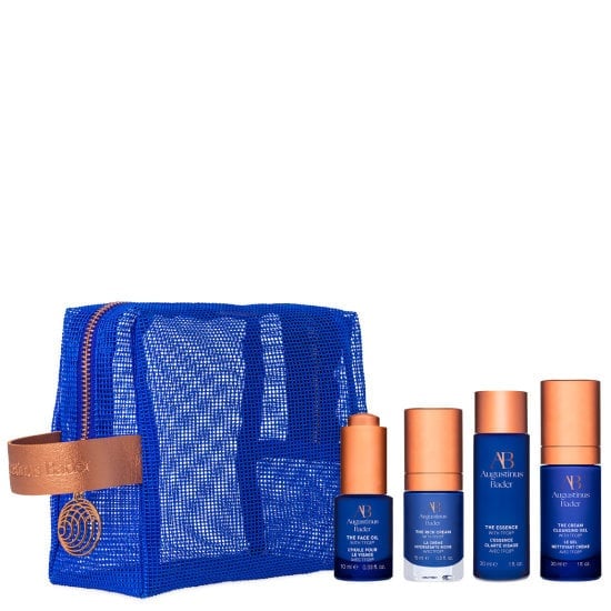Set of skincare products with a blue pouch on a white background
