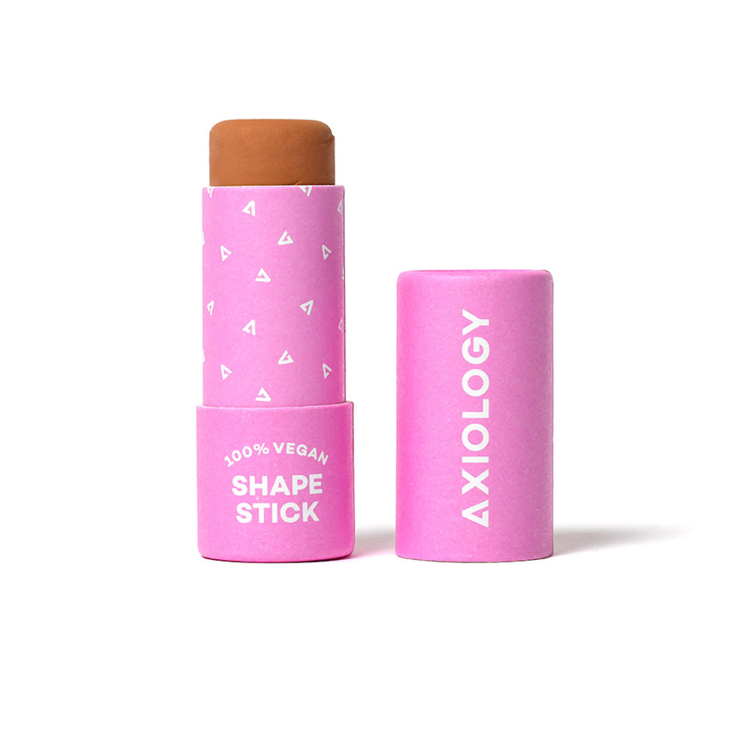 Two pink cosmetic sticks with 'Axiology' branding on a white background