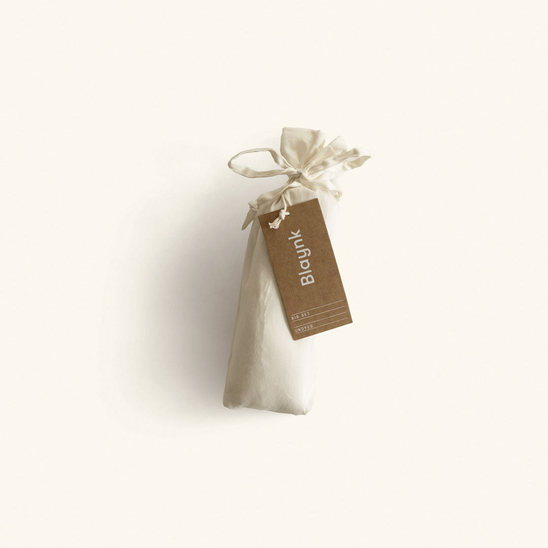 Small beige bag with a 'Blaynk' tag on a white background