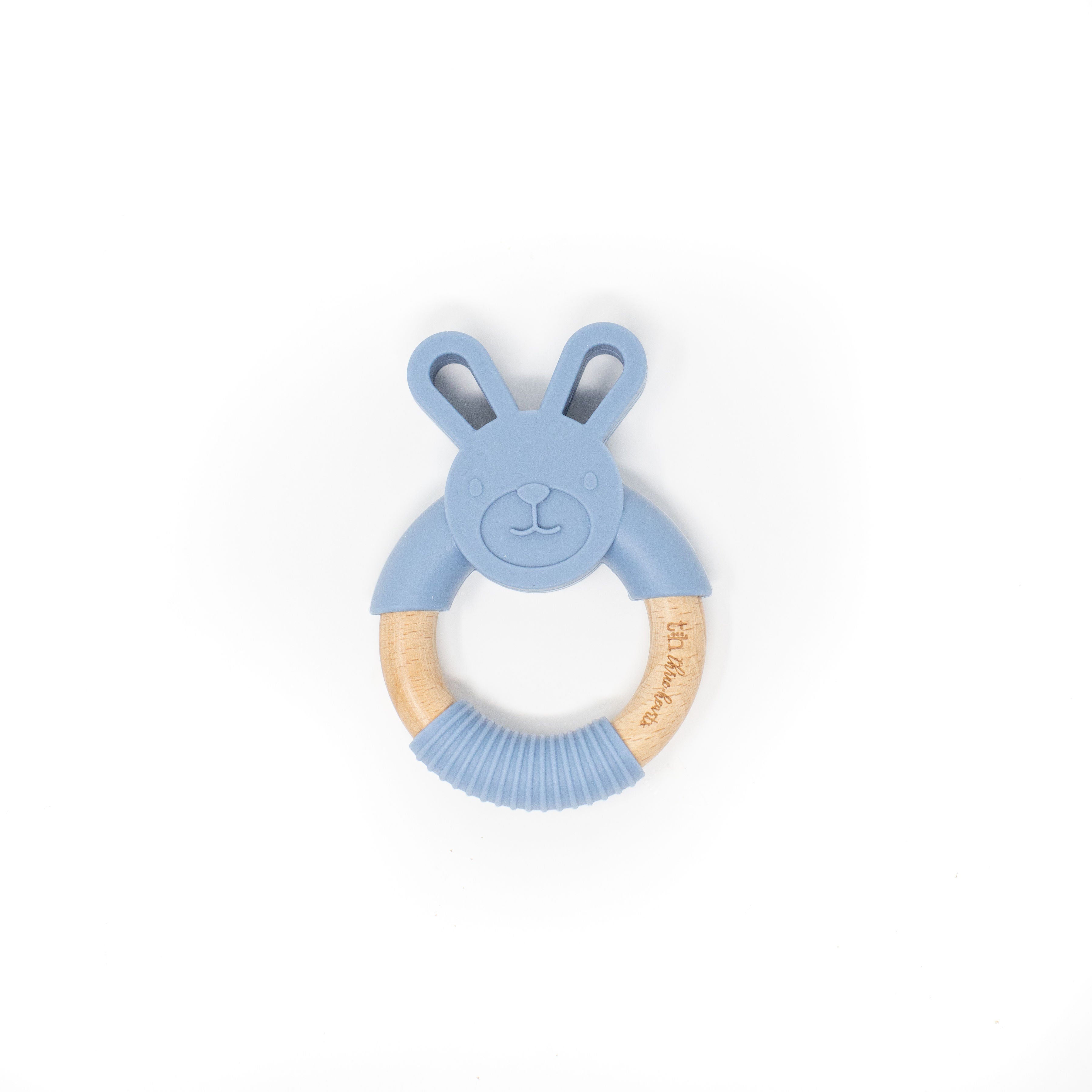 Blue teething ring with wooden handle on a white background