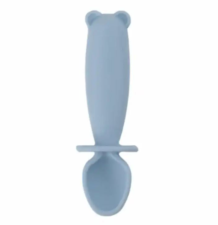 Blue baby spoon with bear handle on a white background