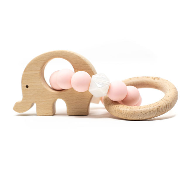 Wooden elephant-shaped teether with pink and white beads on a white background