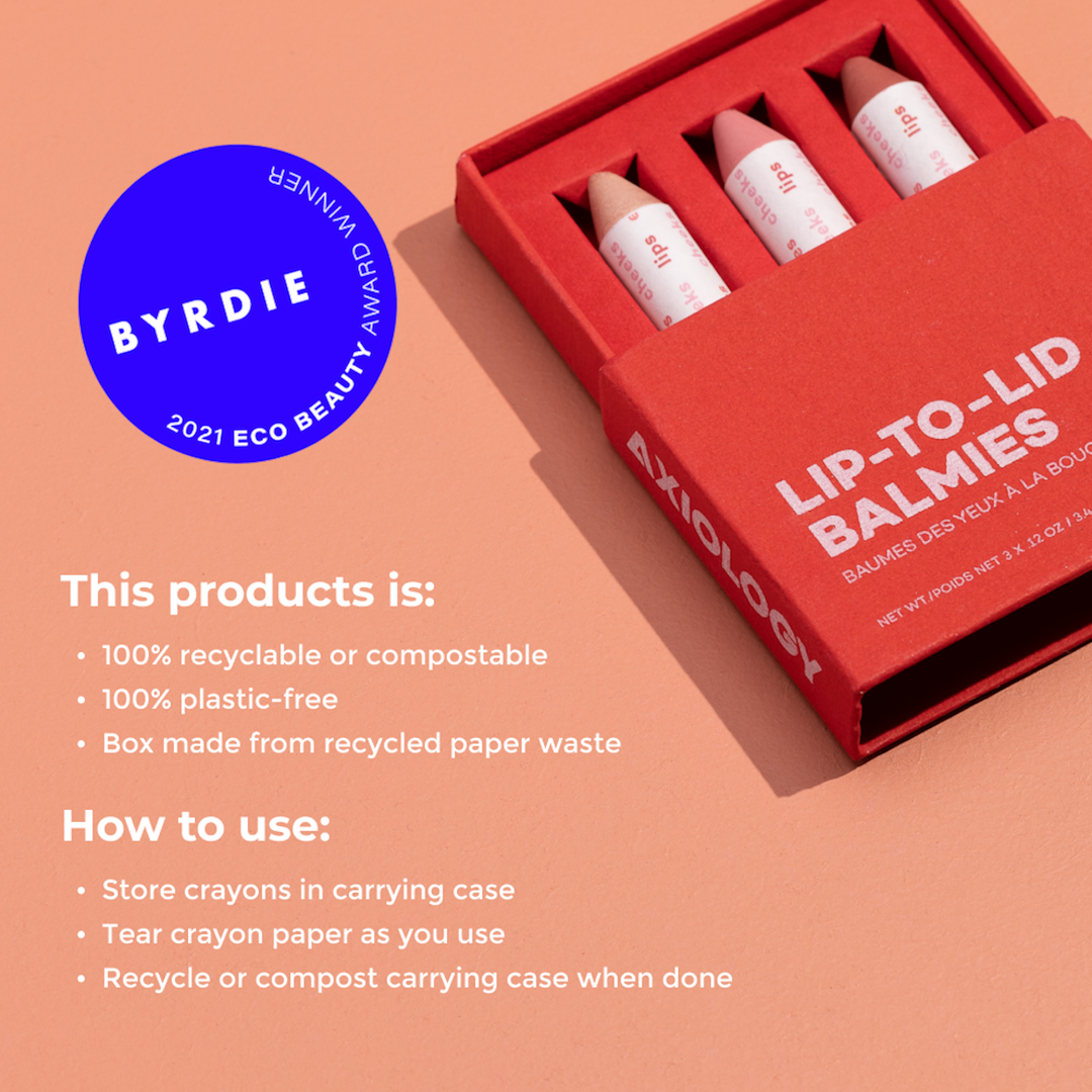 Red box of Axiology lip-to-lid balms with Byrdie 2021 Eco Beauty Award badge on peach background